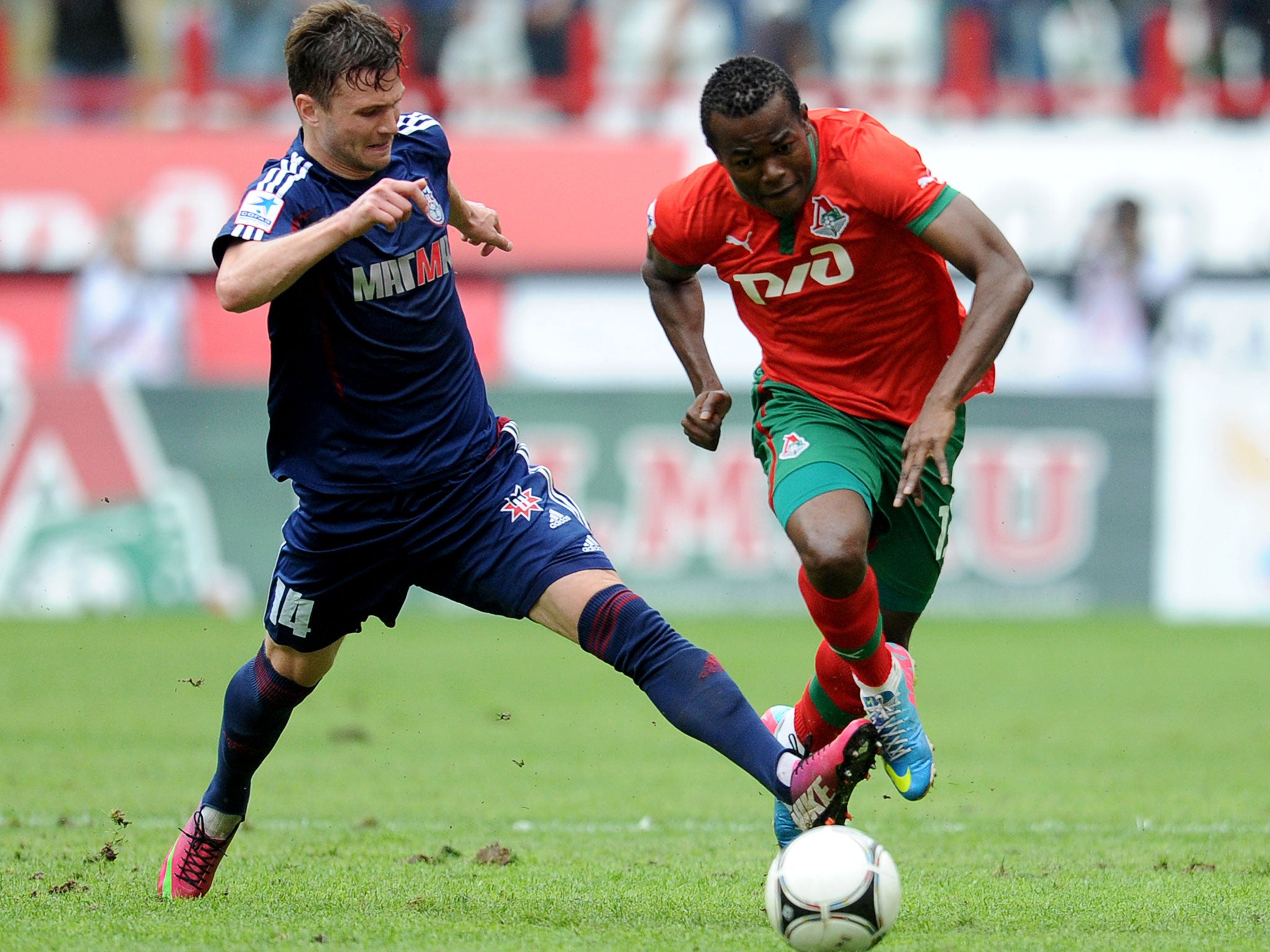 Victor Obinna (right) in action for Lokomotiv Moscow