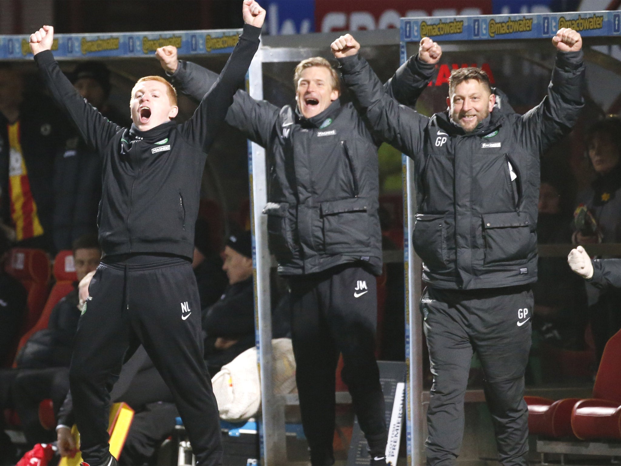 Neil Lennon (left) and his staff celebrate Celtic’s title