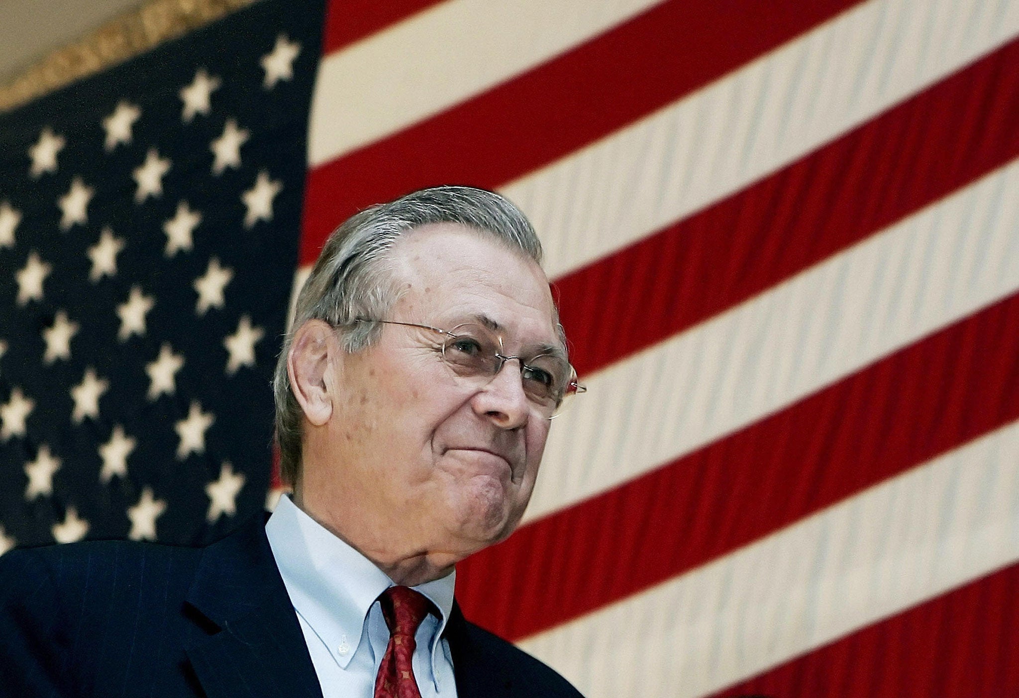 Donald Rumsfeld arrives on stage to address troops in Bagram, Afghanistan in 2005