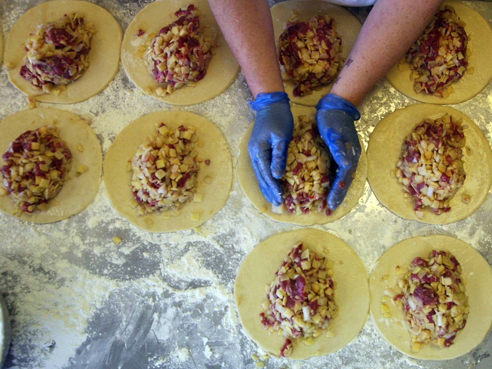 Chunky: A cook prepares the fillings of pasties (Getty)