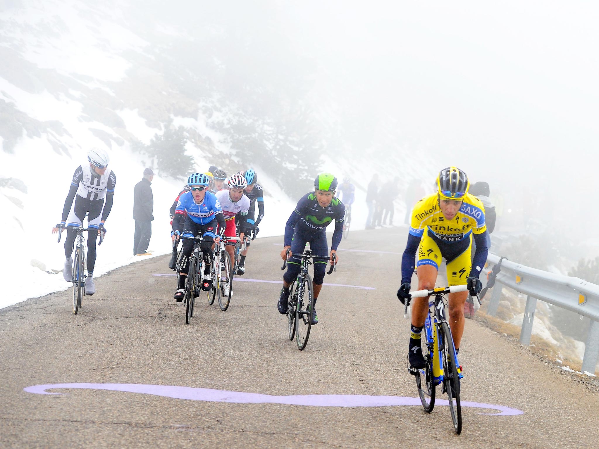 Spain’s Alberto Contador (right) breaks away from the lead group chased by Nairo Quintana, of Colombia, as they head up Vallter 2000 yesterday