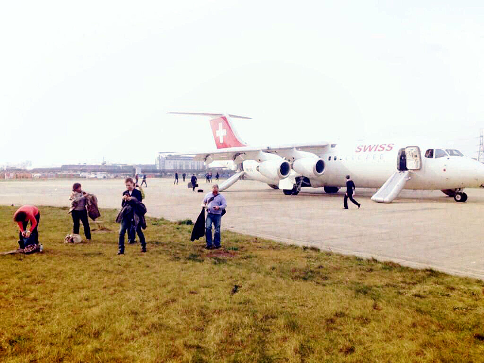 Image captured by Mike Mompi, who was flying to Switzerland for a ski holiday, when the engine of the plane he was aboard, blew up seconds before it was due to leave London City Airport