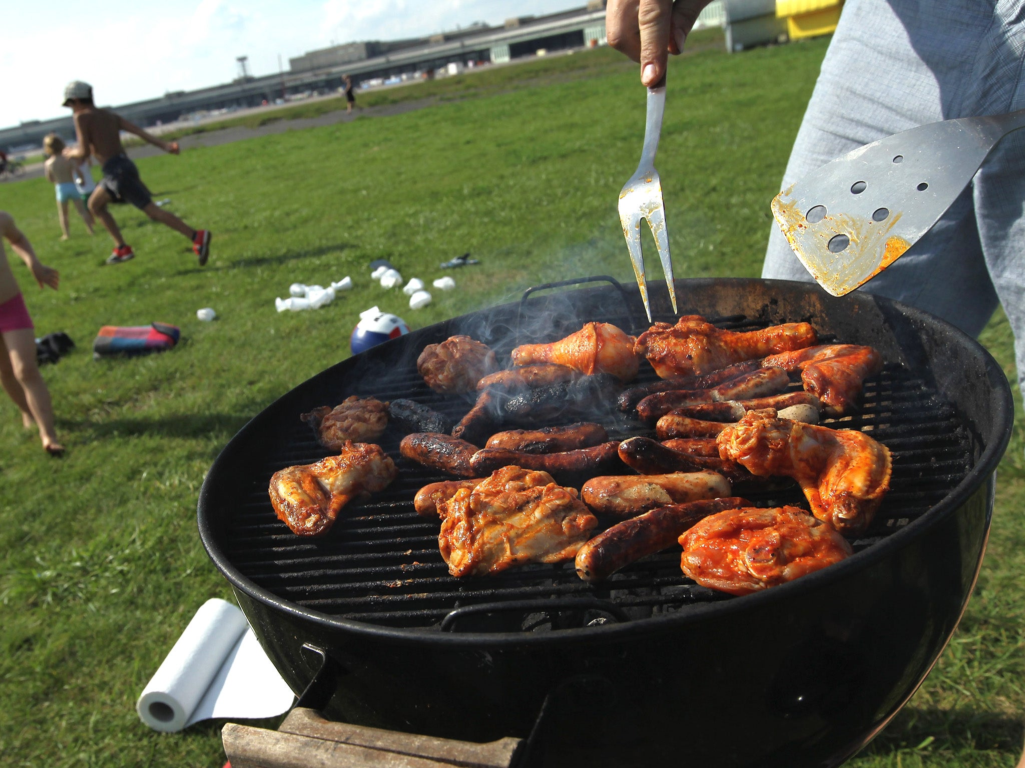 Pour some beer on the barbie: Marinating meat in black beer can reduce potentially cancerous chemicals in grilled meat by half, research has found
