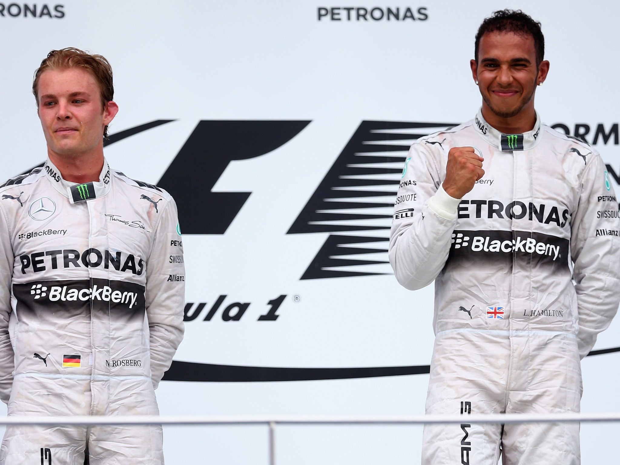 Nico Rosberg (left) and Lewis Hamilton pose on the podium