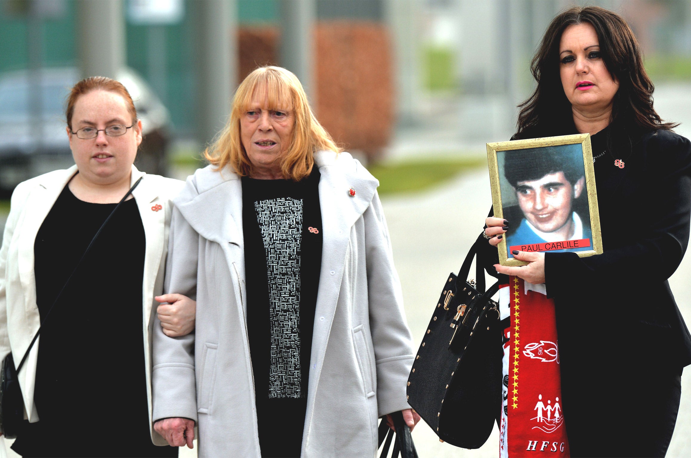 Relatives of those who died in the Hillsborough disaster arrive at a specially commissioned Coroner's Court in Warrington (Getty)