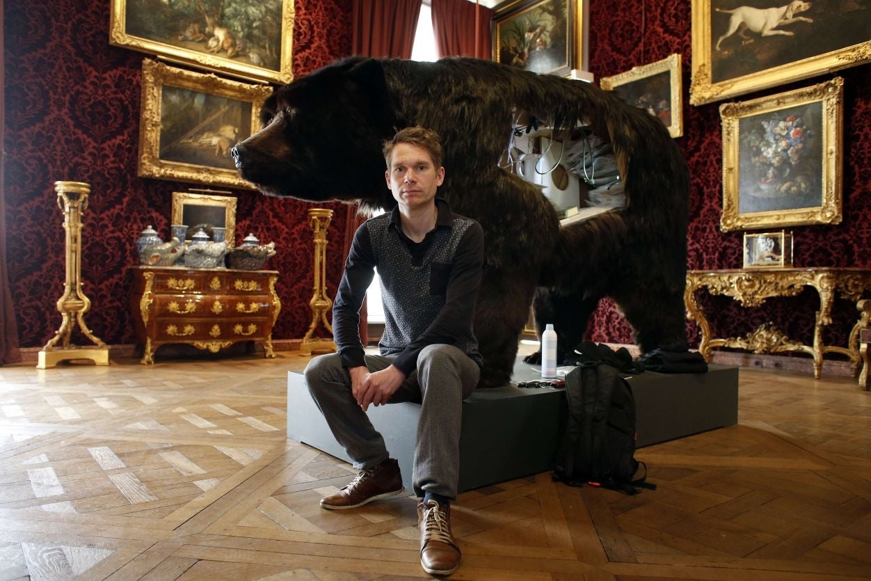 Poincheval poses next to the bear, showing where he will be leaving for two weeks