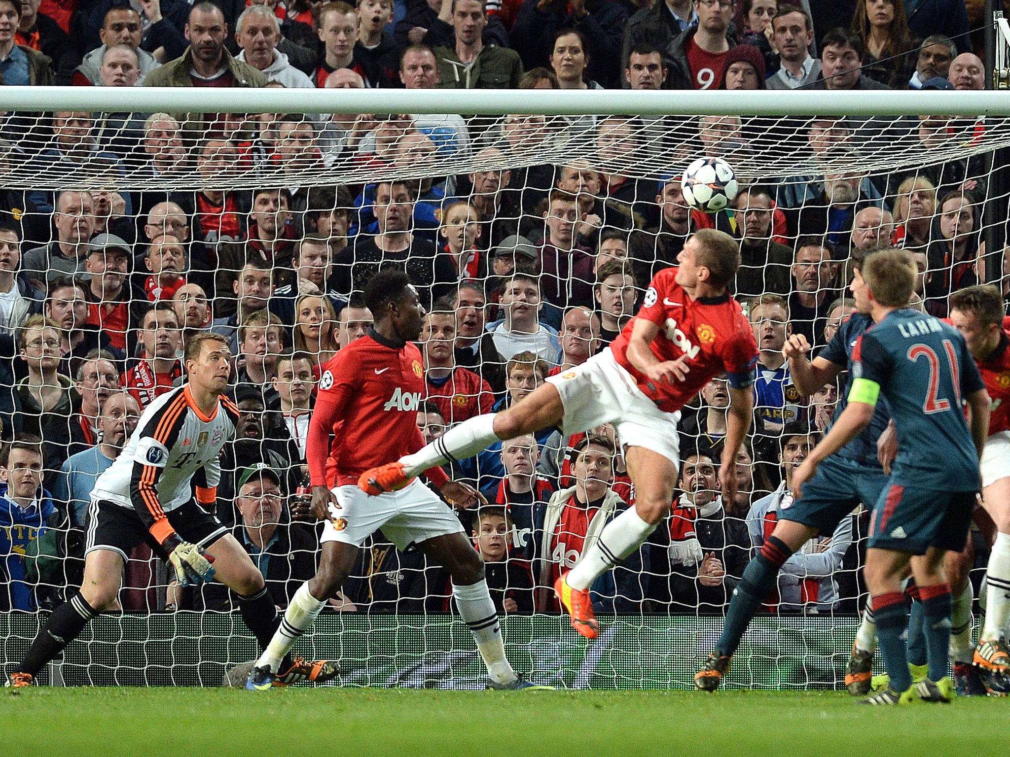 Nemanja Vidic directs a header past Manuel Neuer to give United the lead