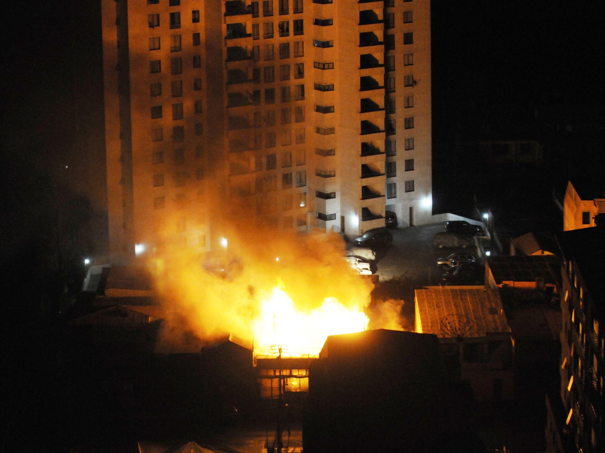 A fire burns at a restaurant after an earthquake in Iquique