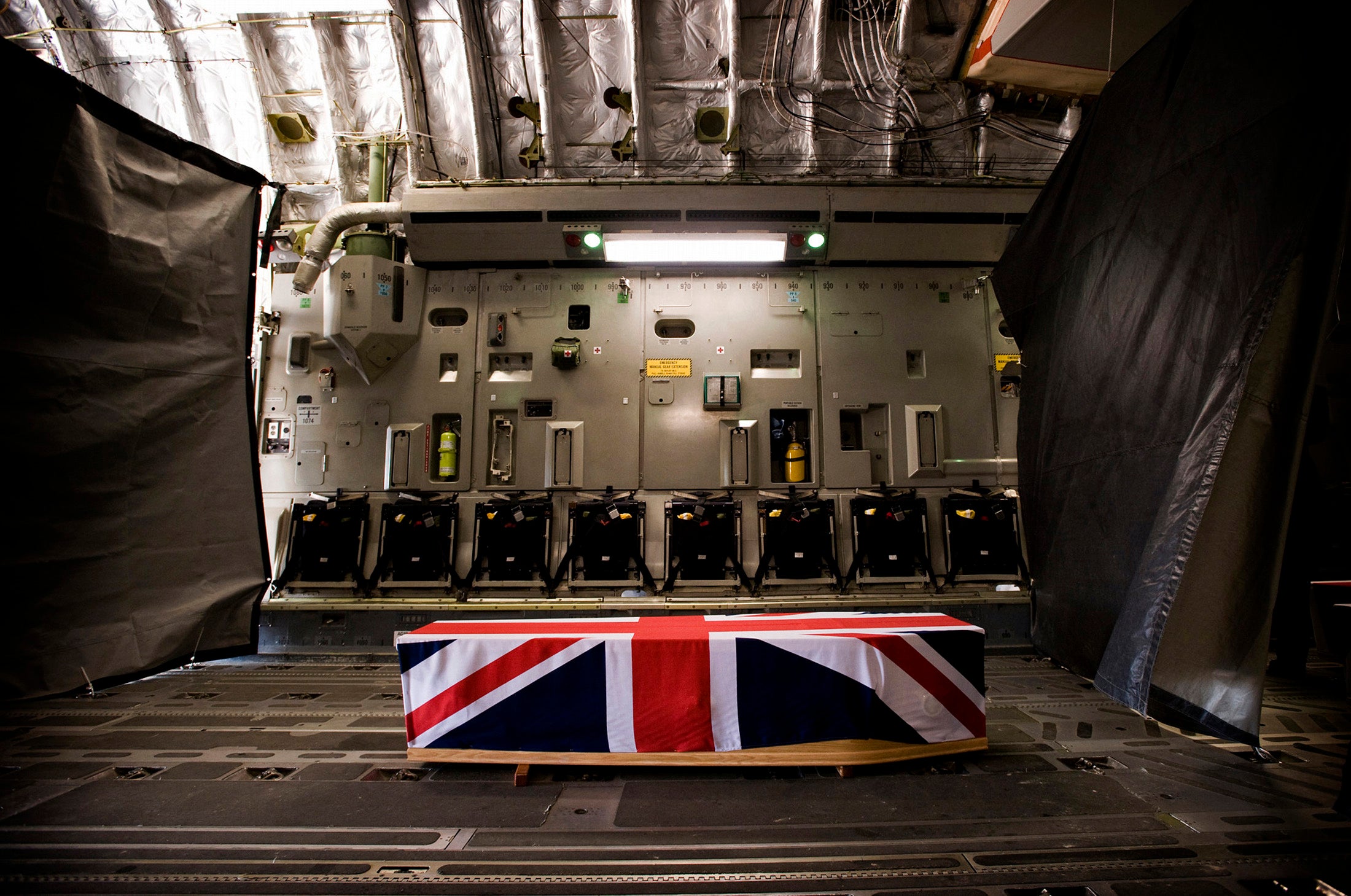 A coffin containing the bodyof Sergeant Paul Fox is seen resting in an aircraft before repatriation in 2010.