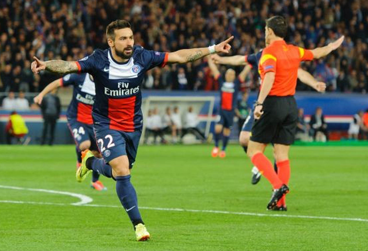 Ezequiel Lavezzi of PSG celebrates after scoring the opening goal during the UEFA Champions League match between Paris Saint Germain and Chelsea in Paris, France