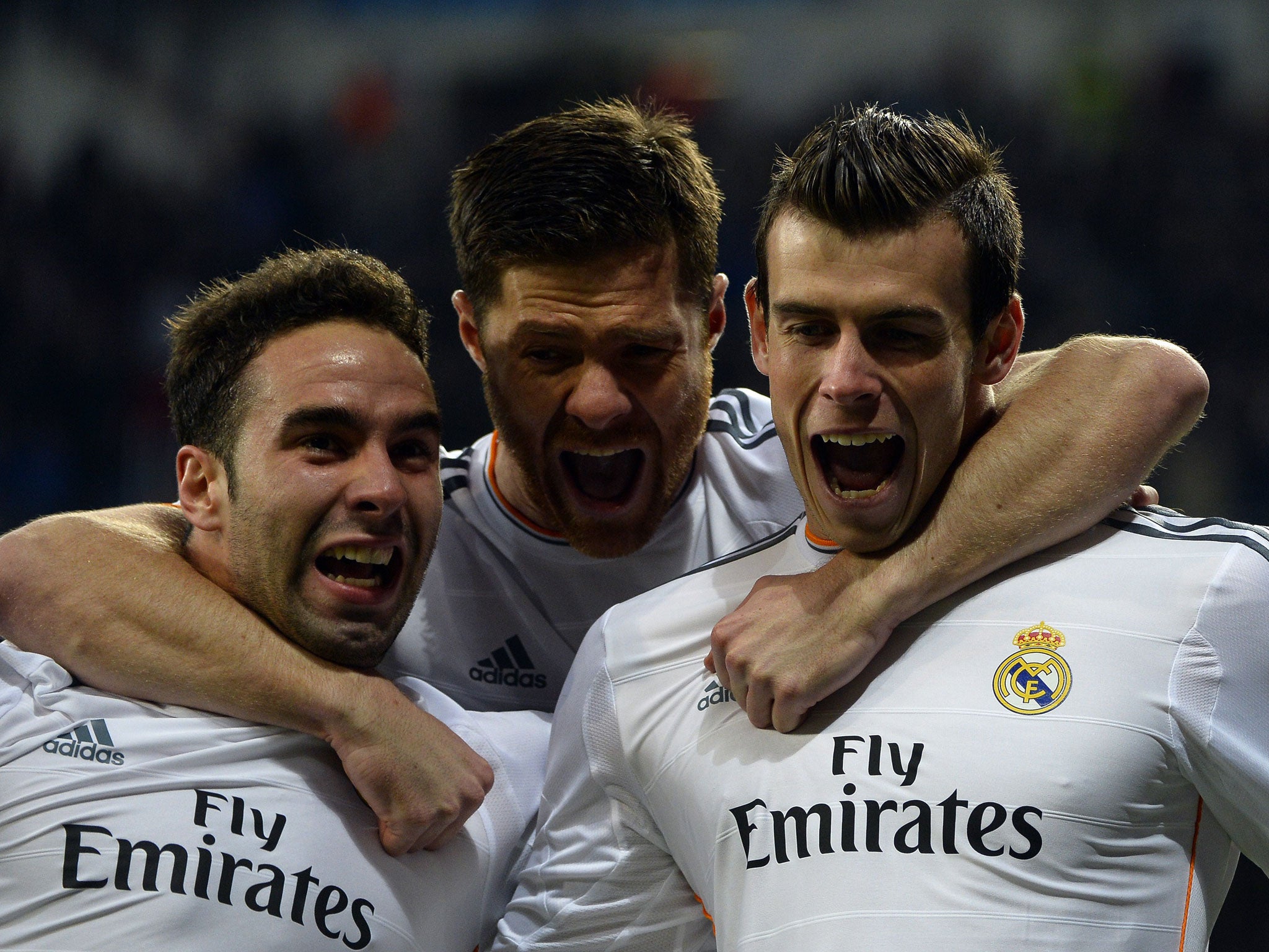 Gareth Bale (right) celebrates with his team-mates after scoring