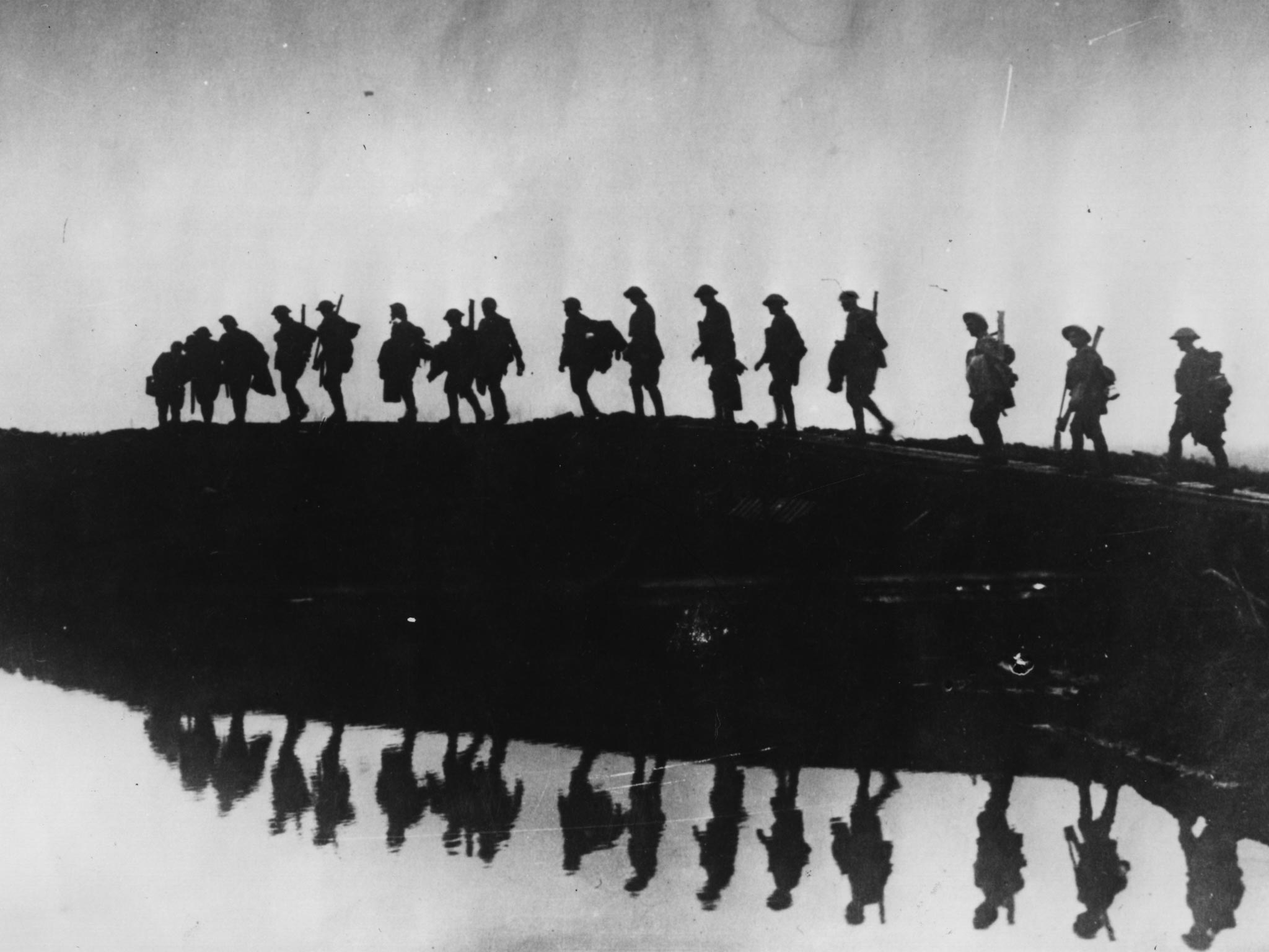 Supporting troops of the 1st Australian Division walking on a duckboard track near Hooge, in the Ypres Sector