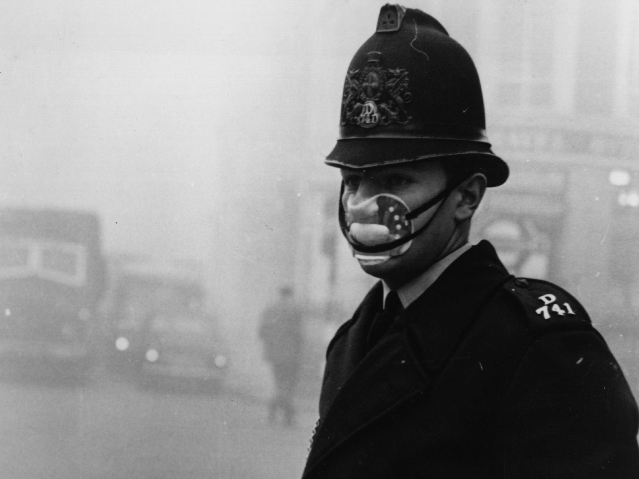 A London policeman wearing a mask for protection against the thick fog which hit most of the country and turned to smog in the city