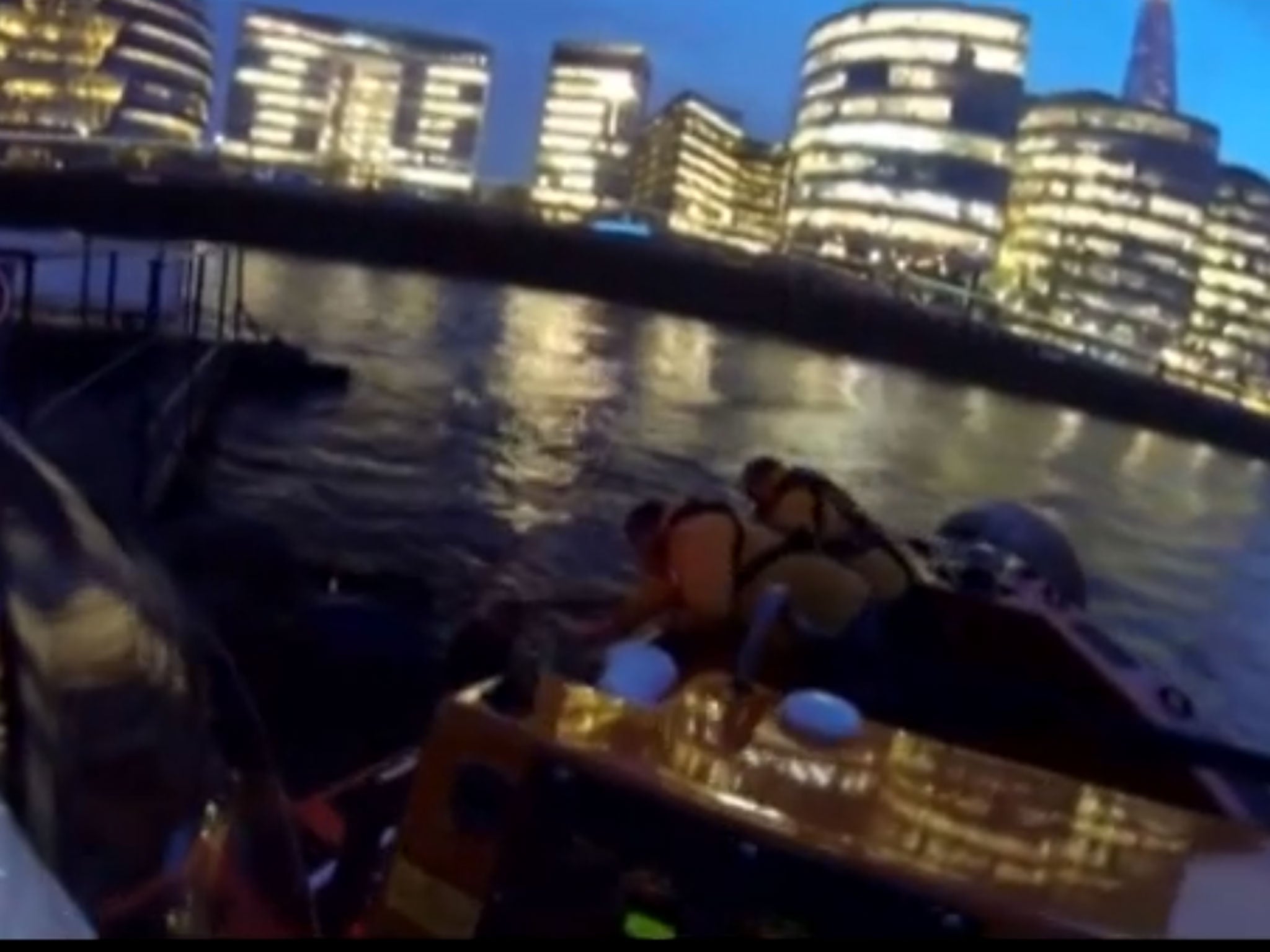 The RNLI crew pull the man from the treacherous waters