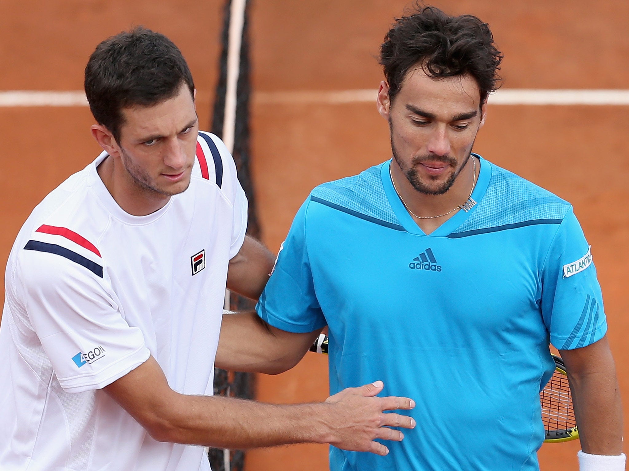 Fabio Fognini of Italy shakes hands at the net after his four set victory against James Ward of Great Britain during day one of the Davis Cup World Group Quarter Final