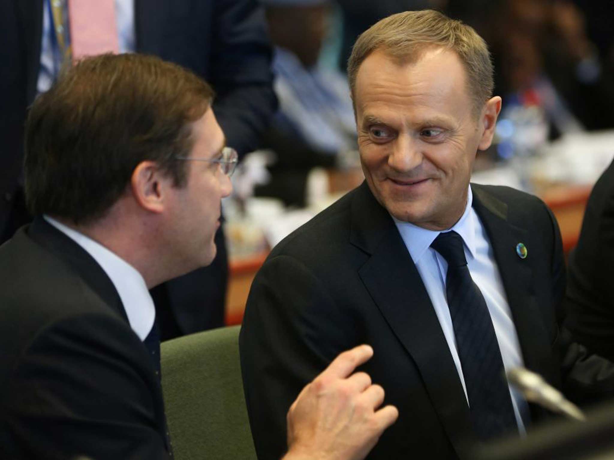 Donald Tusk, Poland's Prime Minister, speaks to the Belgium PM