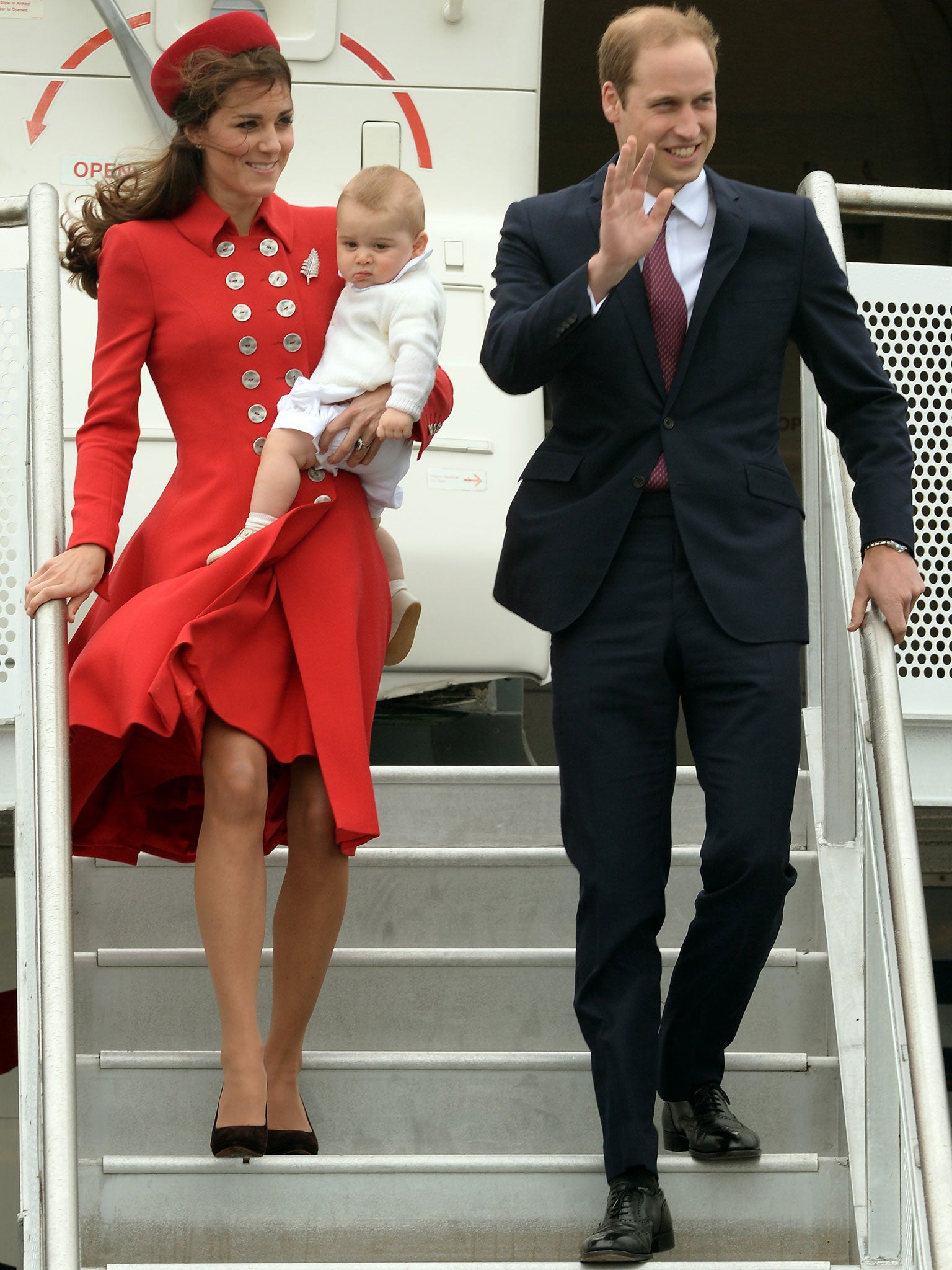 The Duke and Duchess of Cambridge get off the plane with Prince George at Wellington Military Terminal