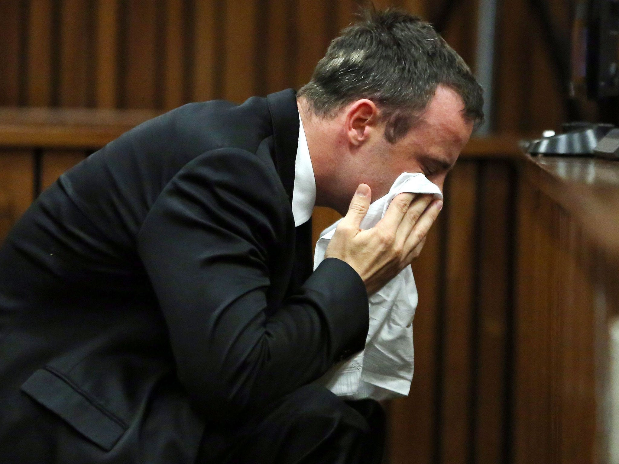 Oscar Pistorius reacts during his trial at the North Gauteng High Court in Pretoria