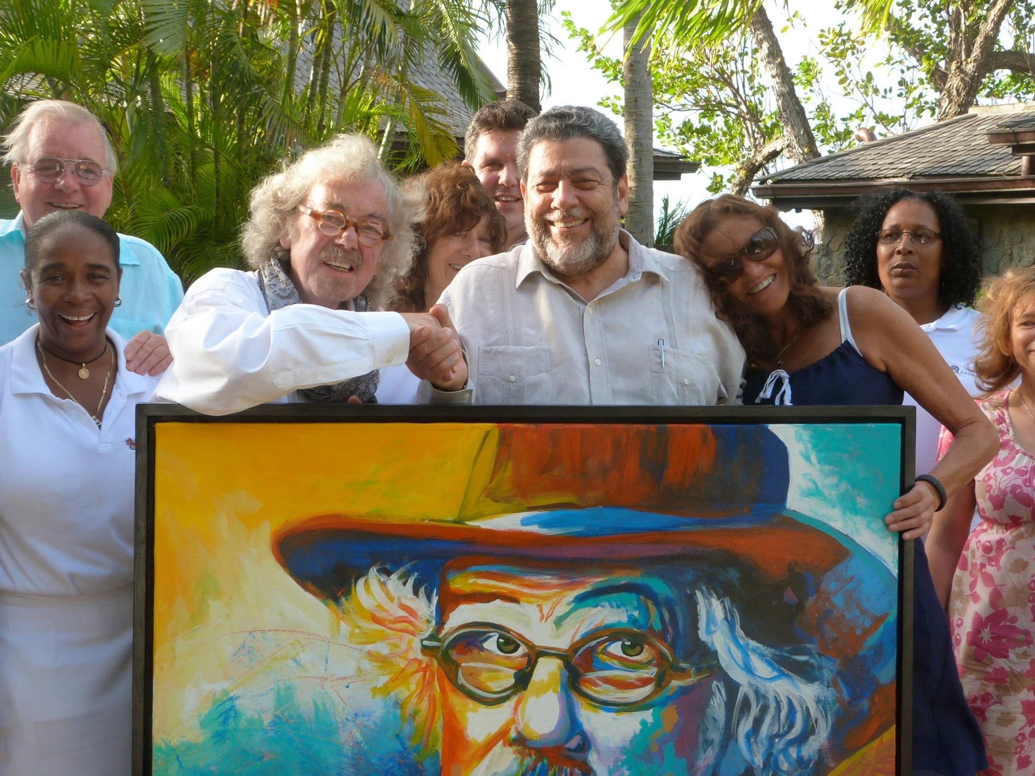 The PM of St.Vincent and The Grenadines presents Felix Dennis
with a gift of a painting by artist Calvert