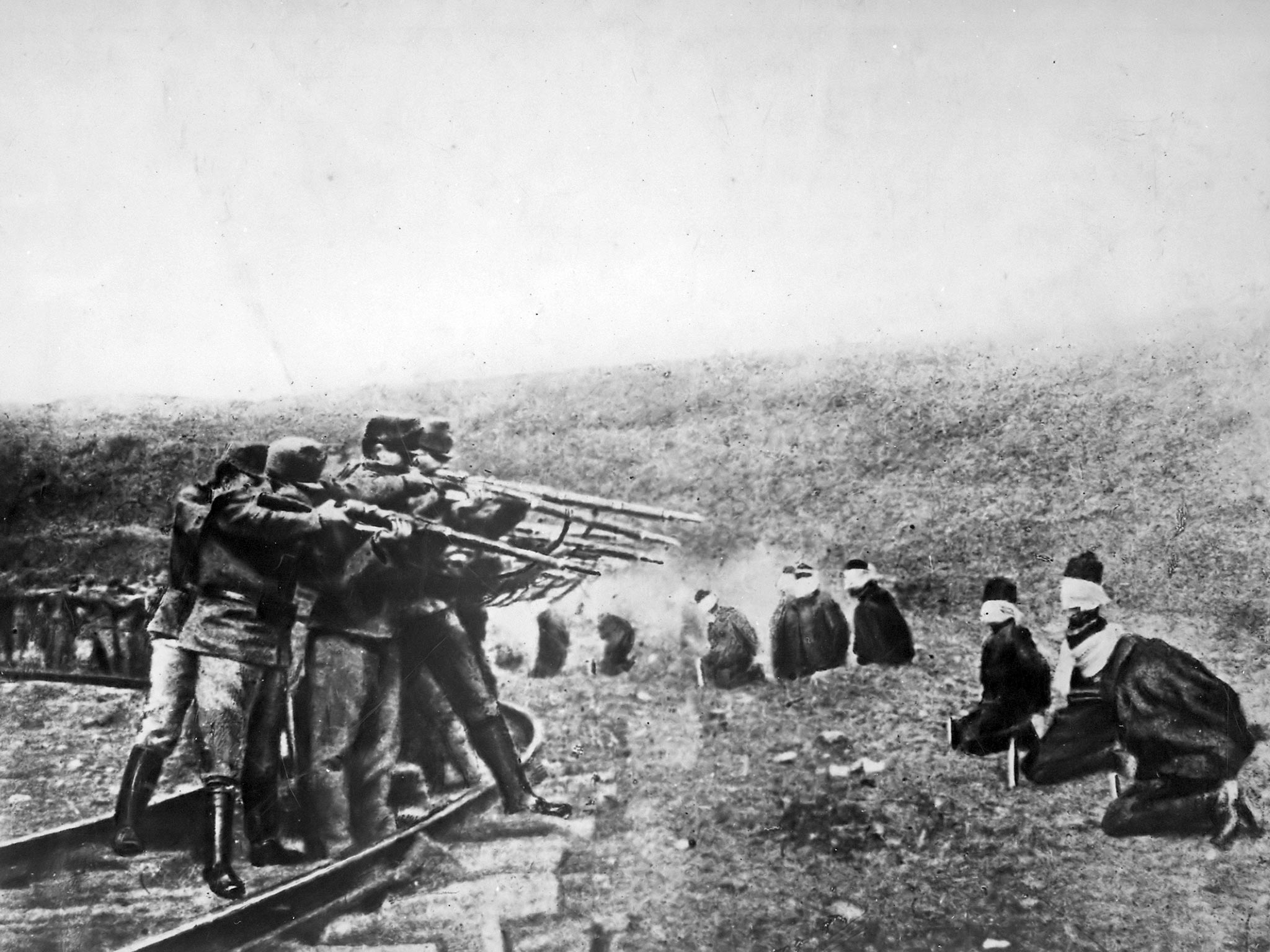 Austria's Atrocities. Blindfolded and in a kneeling position, patriotic Jugo-Slavs in Serbia near the Austrian lines were arranged in a semi-circle and ruthlessly shot at a command