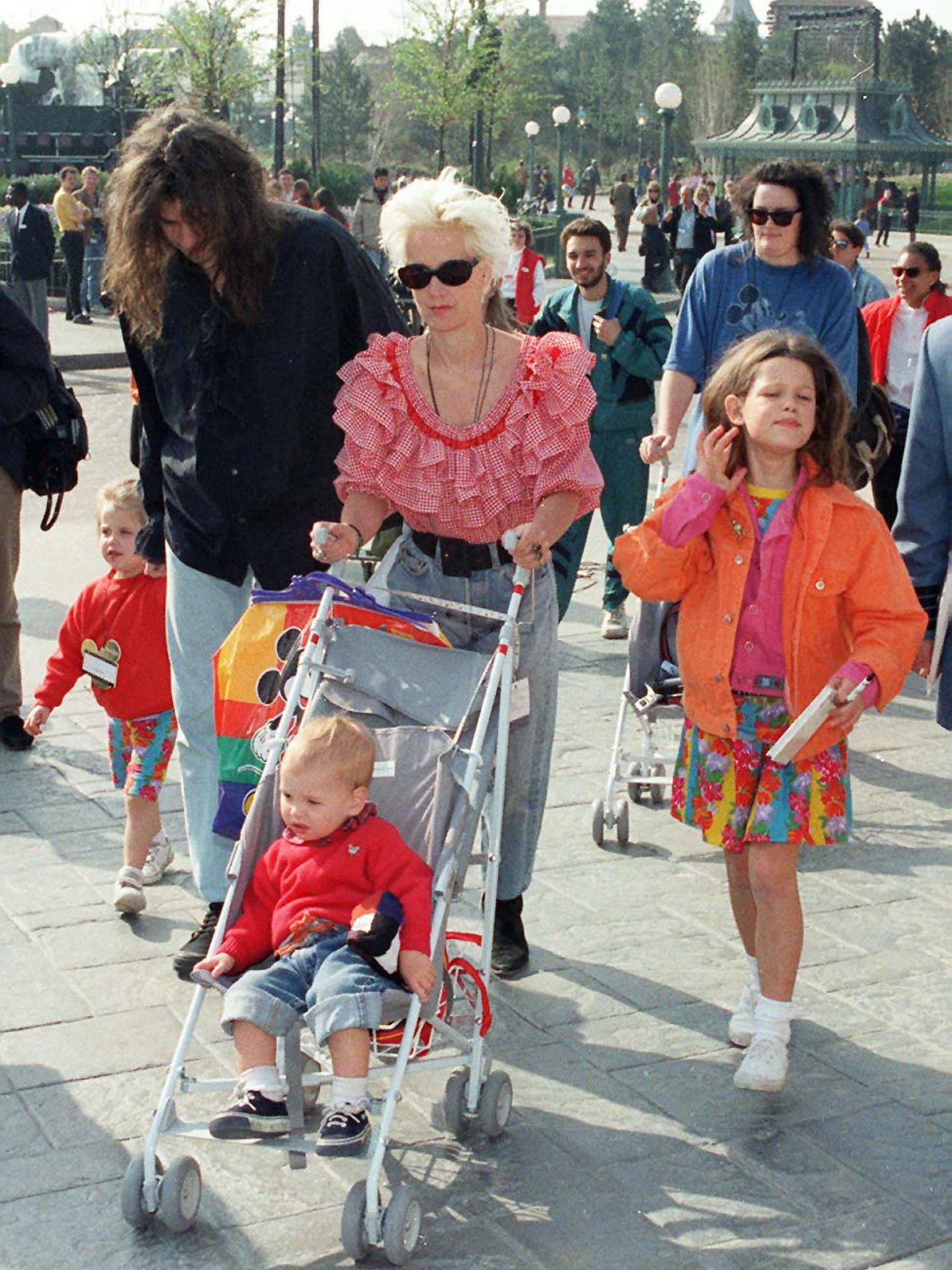 Paula Yates and ex-husband Bob Geldof with their three daughters Fifi Trixiebelle (right), Peaches (left) and Pixie, during a visit to EuroDisney in 1992