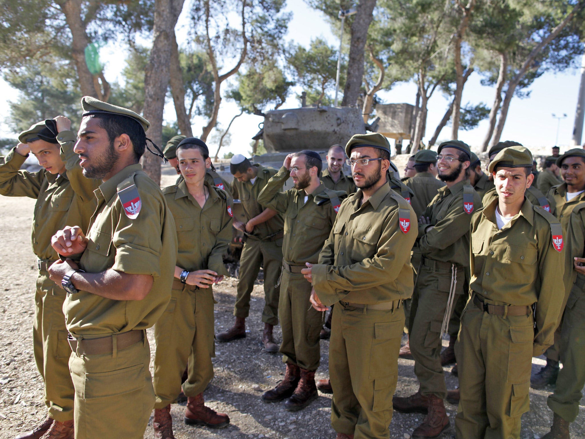 Ultra-Orthodox Israelis gather prior to a military graduation ceremony in Jerusalem