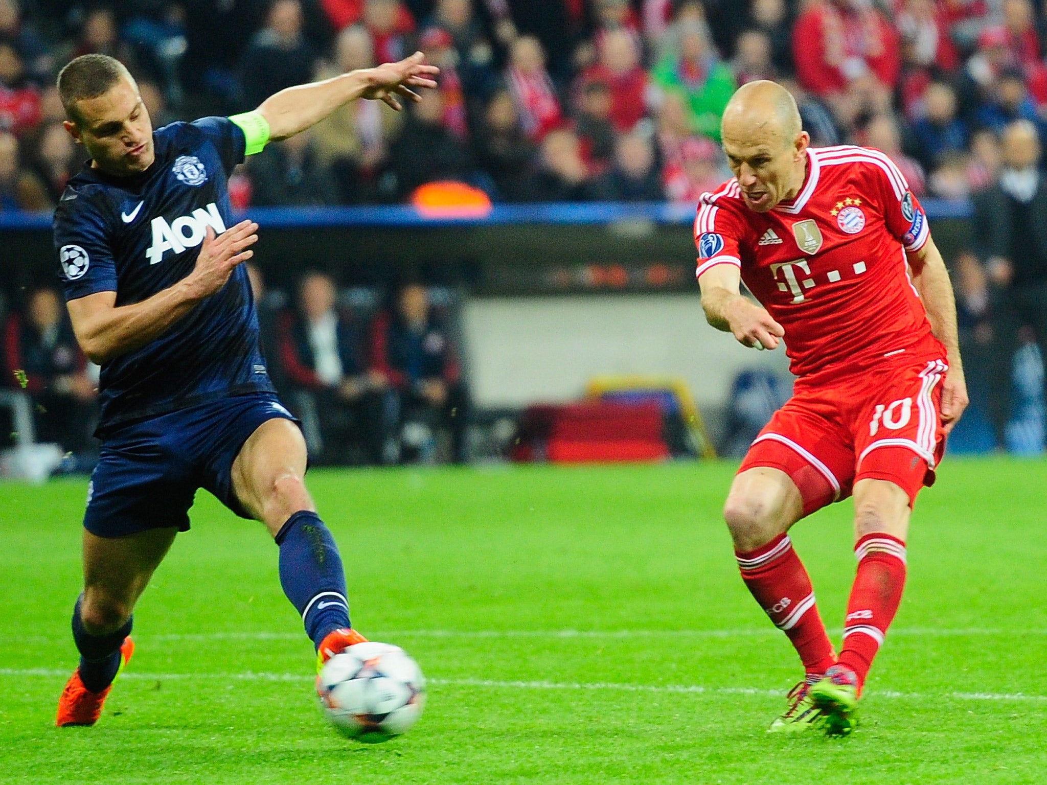 Arjen Robben's shot takes a deflection off Nemanja Vidic's left foot to deceive David de Gea and put the tie beyond United