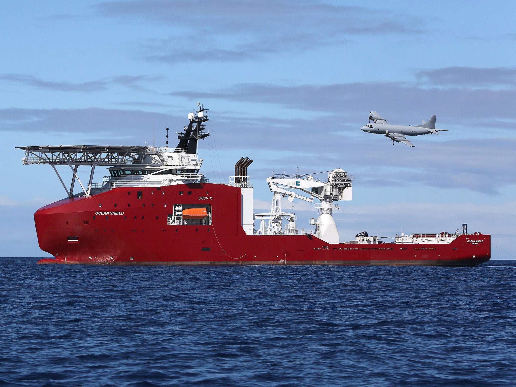 A Royal Australian Air Force AP-3C Orion fly past the Australian Defence Vessel Ocean Shield on a mission to drop sonar buoys to assist in the acoustic search in support of Operation Southern Indian Ocean