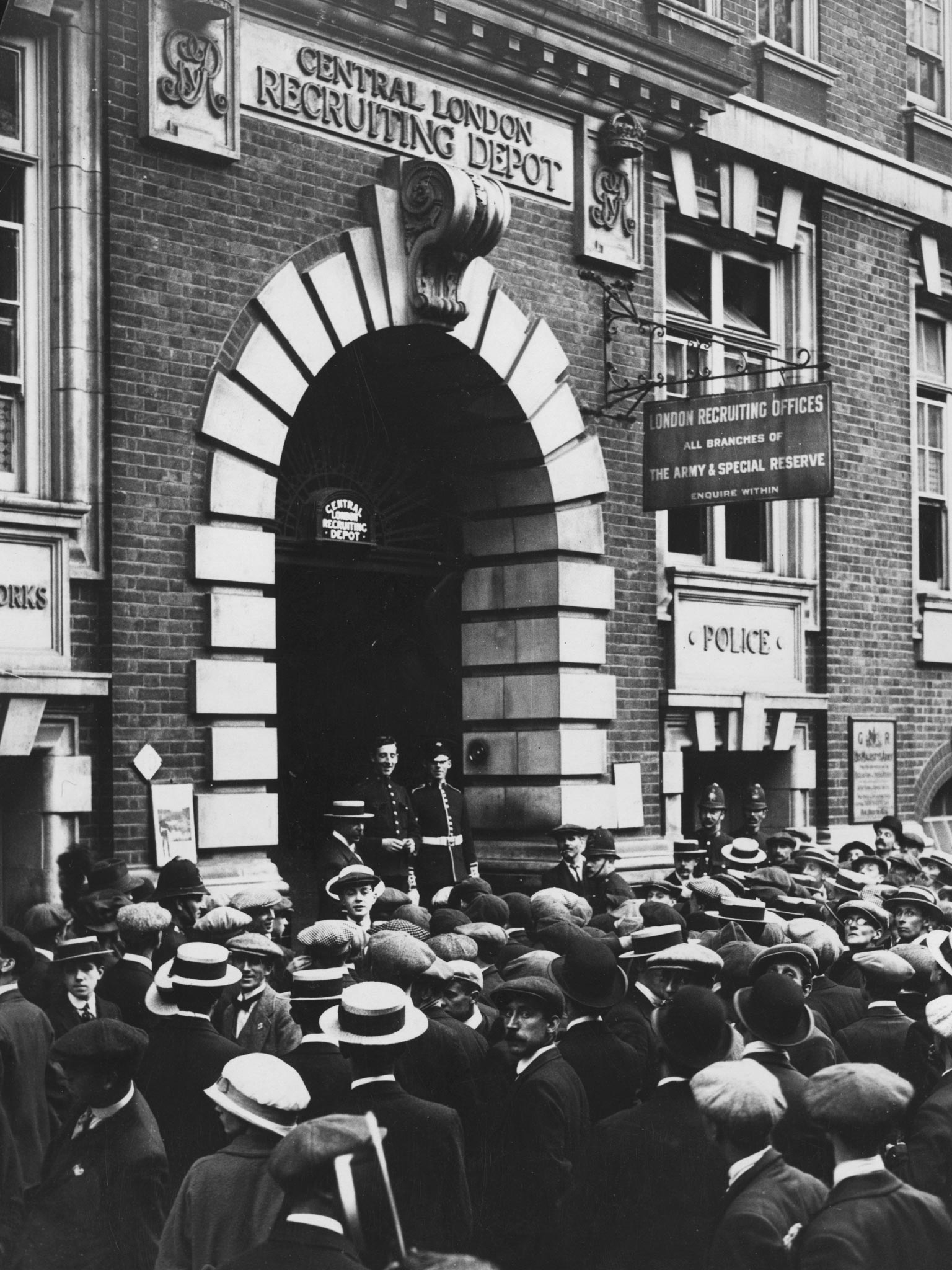 Crowds gather outside a recruitment office