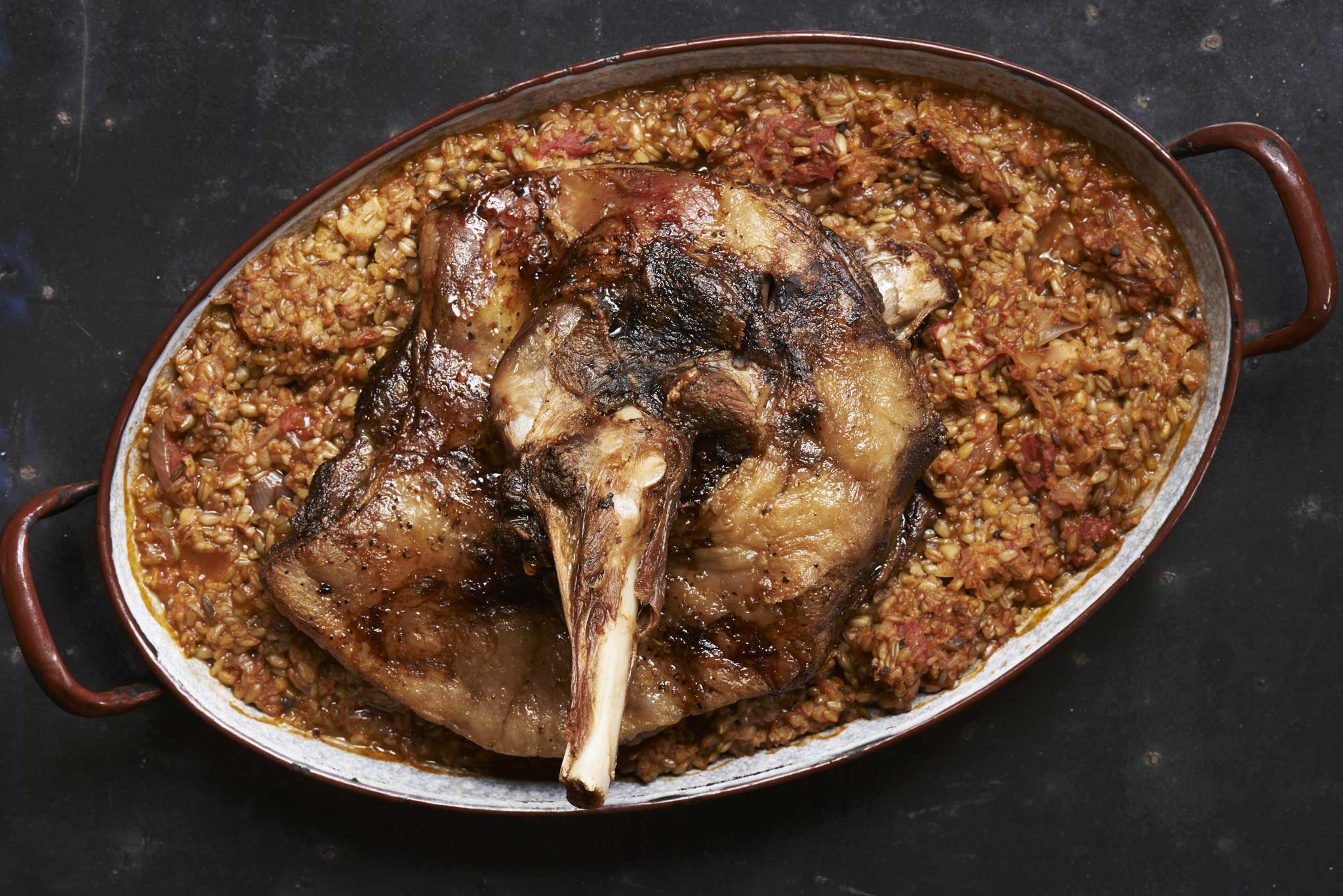 Versatile: Slow-roast lamb shoulder with spiced freekeh