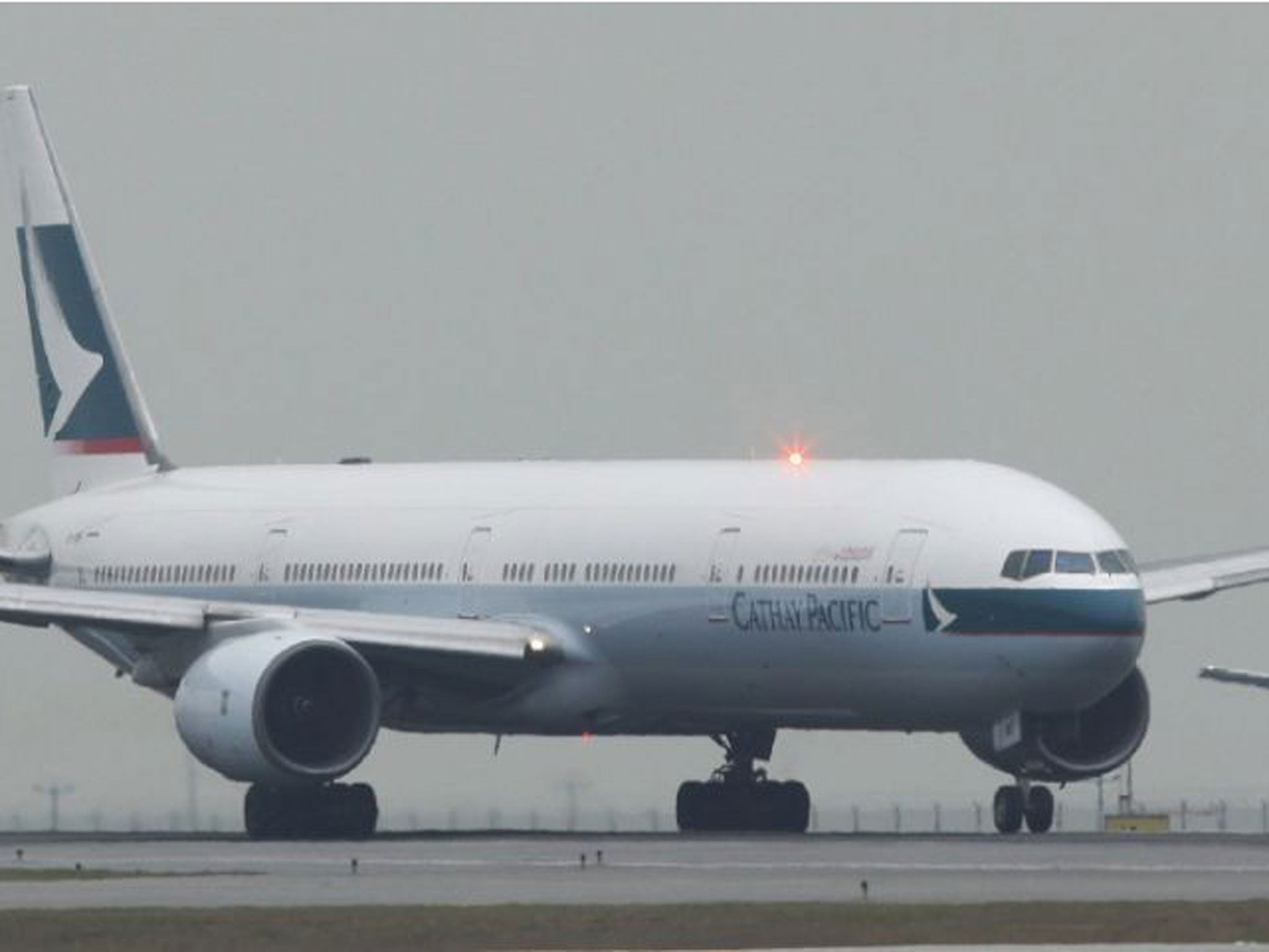 Chinese authorities say Cathay Pacific flight 831 from New York to Hong Kong was stranded for more than 16 hours in Zhuhai, China Sunday March 30, 2014 because of a hail storm and limits on the crew's work hours.