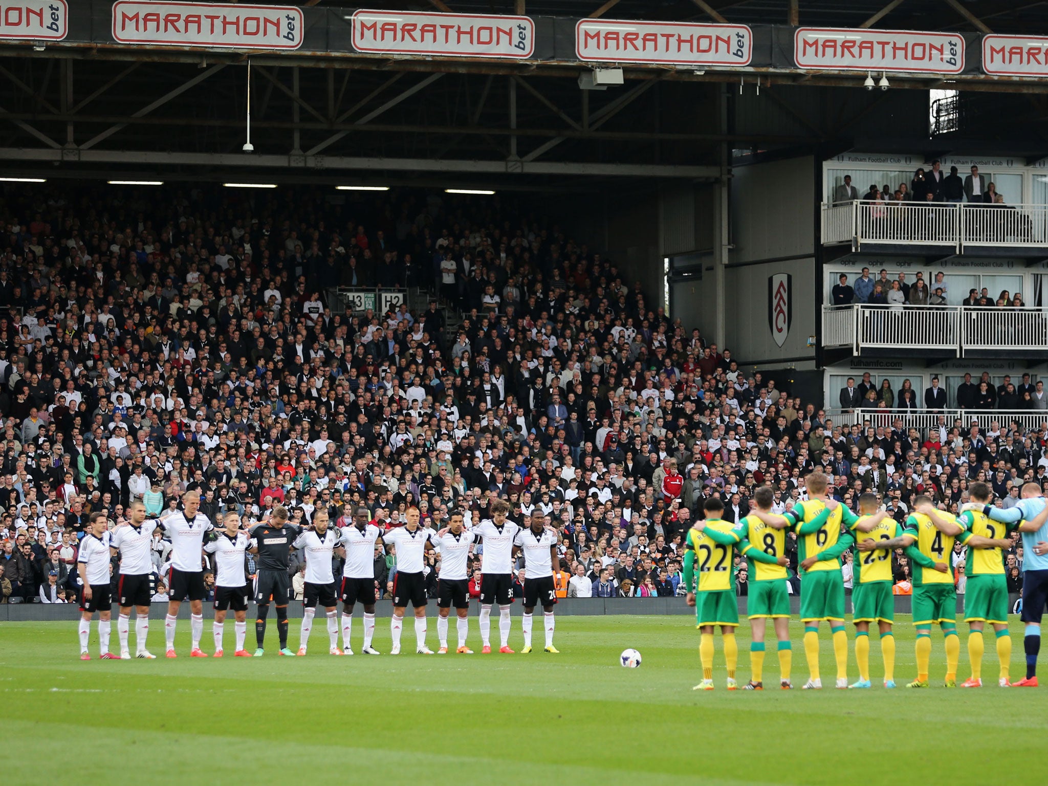 Players and fans observe a minute's silence to mark the 25th anniversary of the Hillsborough disaster