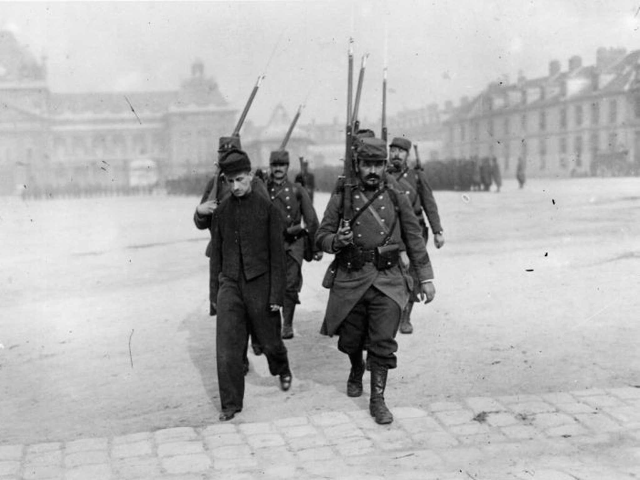 A French firing squad escorts a deserter to his execution in November 1914