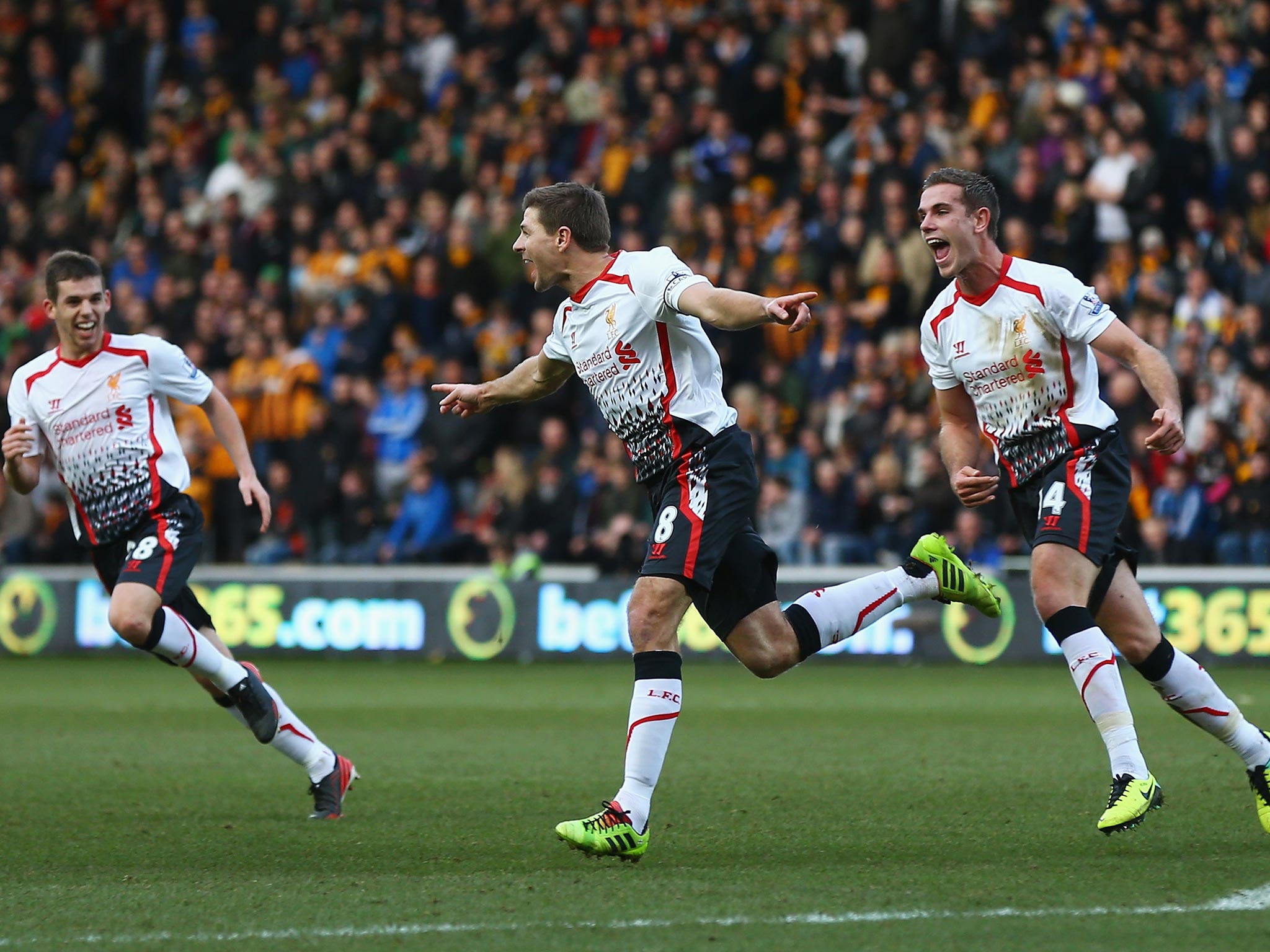 Jon Flanagan, Steven Gerrard and Jordan Henderson celebrate Gerrard's goal against Hull