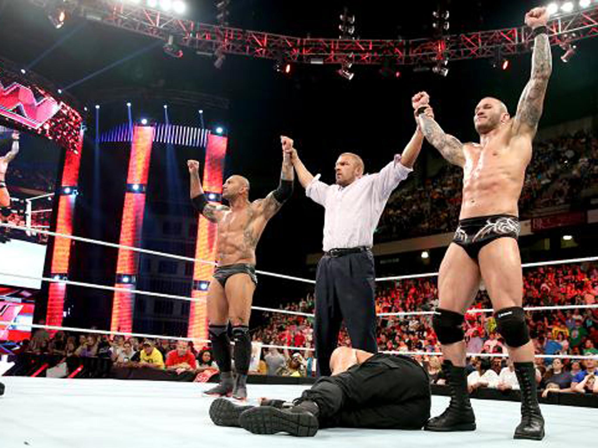 Batista, Triple H and Randy Orton reunite as Evolution to take down The Shield