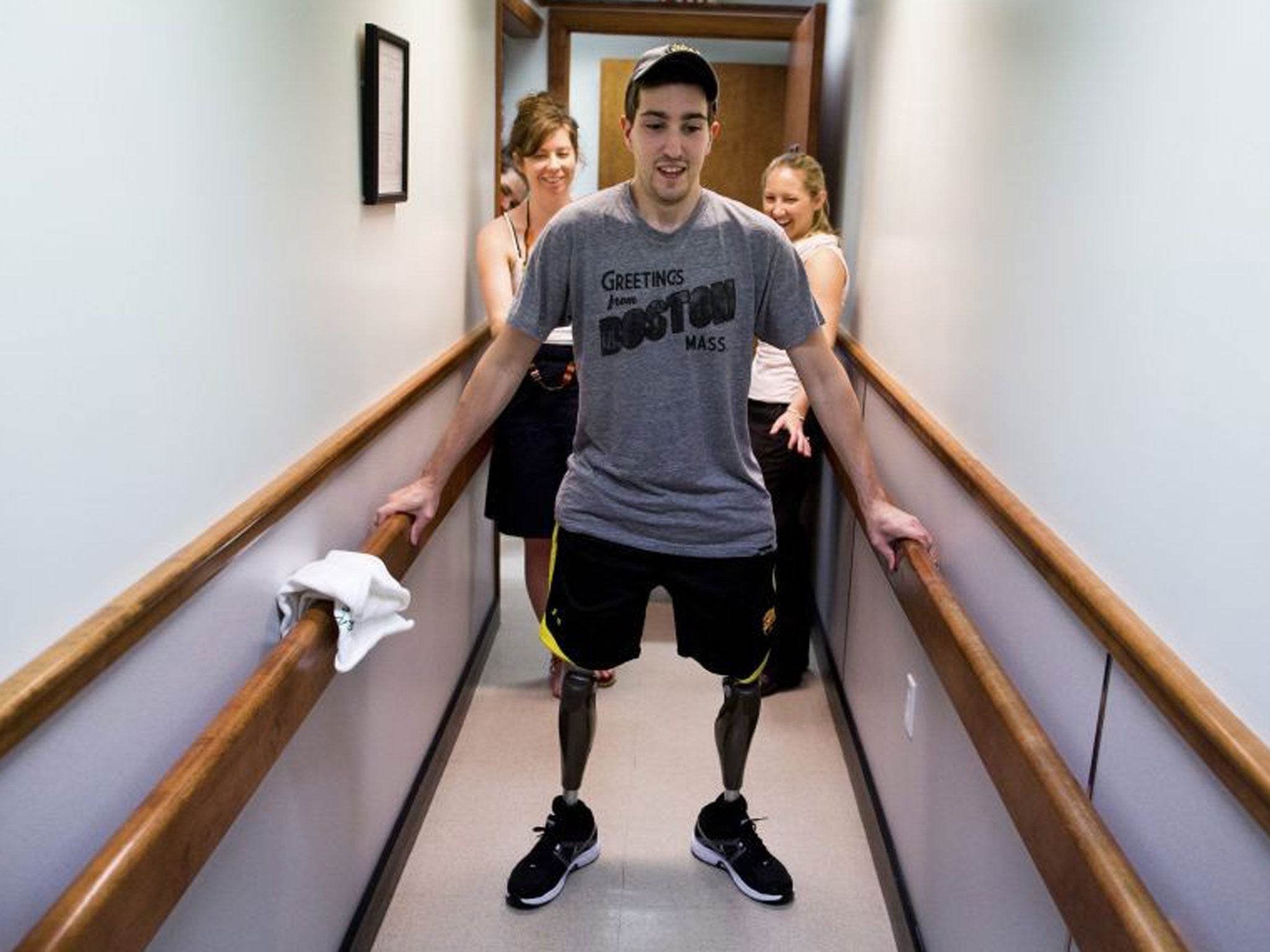 A handout from The New York Times shows Jeff Bauman, who lost his lower legs in the Boston Marathon bombings, walks on his own for the first time since the marathon at a final fitting for his prosthetic legs, in Massachusetts, USA, 31 May 2013