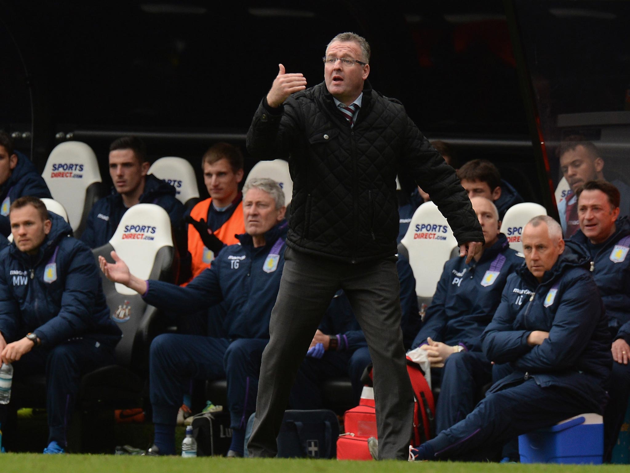 Aston Villa manager Paul Lambert remonstrates on the sideline in front of his coaching staff