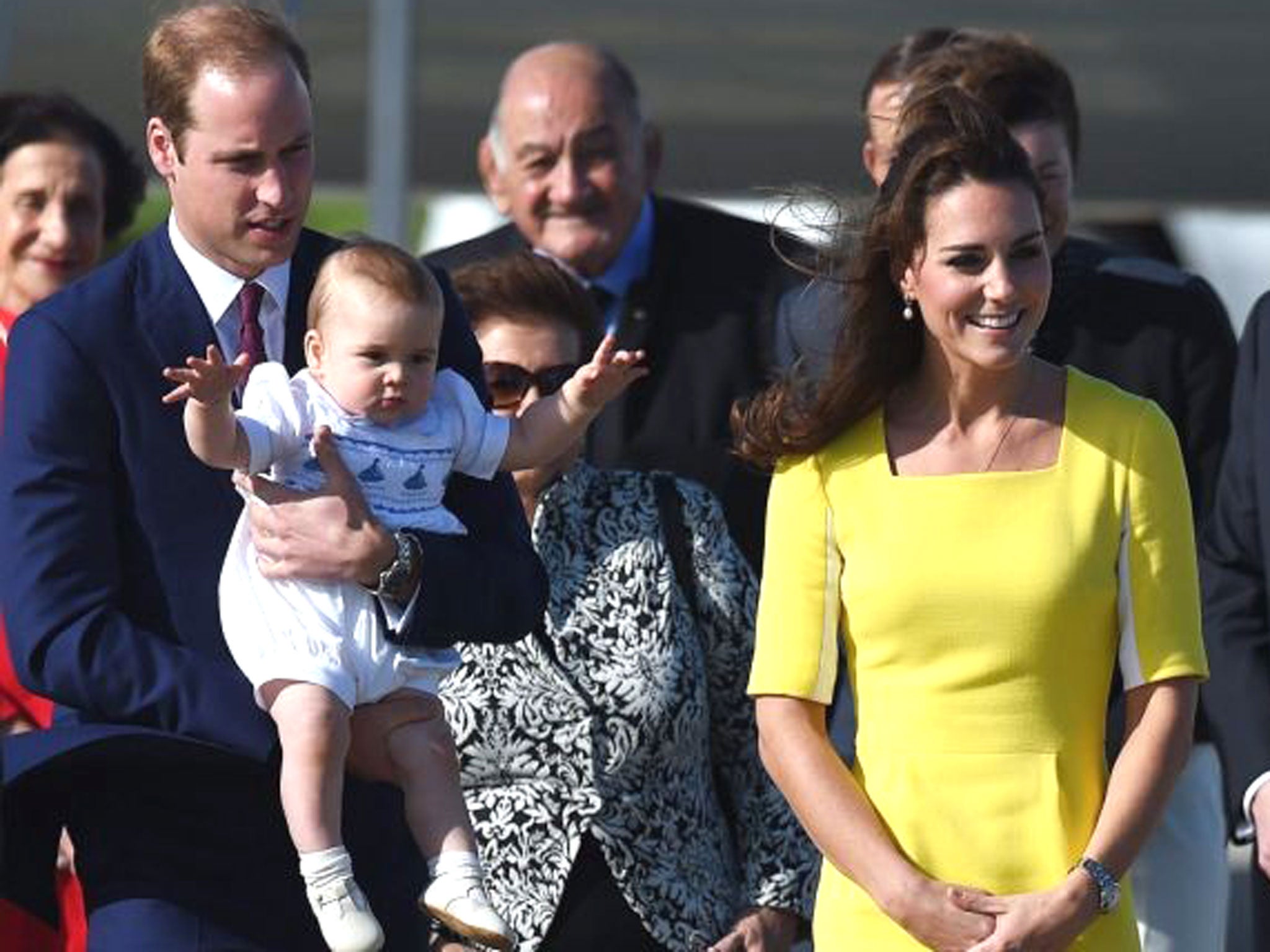 Britain's Prince William, Duke of Cambridge (L), Catherine, Duchess of Cambridge (2-R) and son Prince George arrive for their Australian tour in Sydney, 16 April 2014.