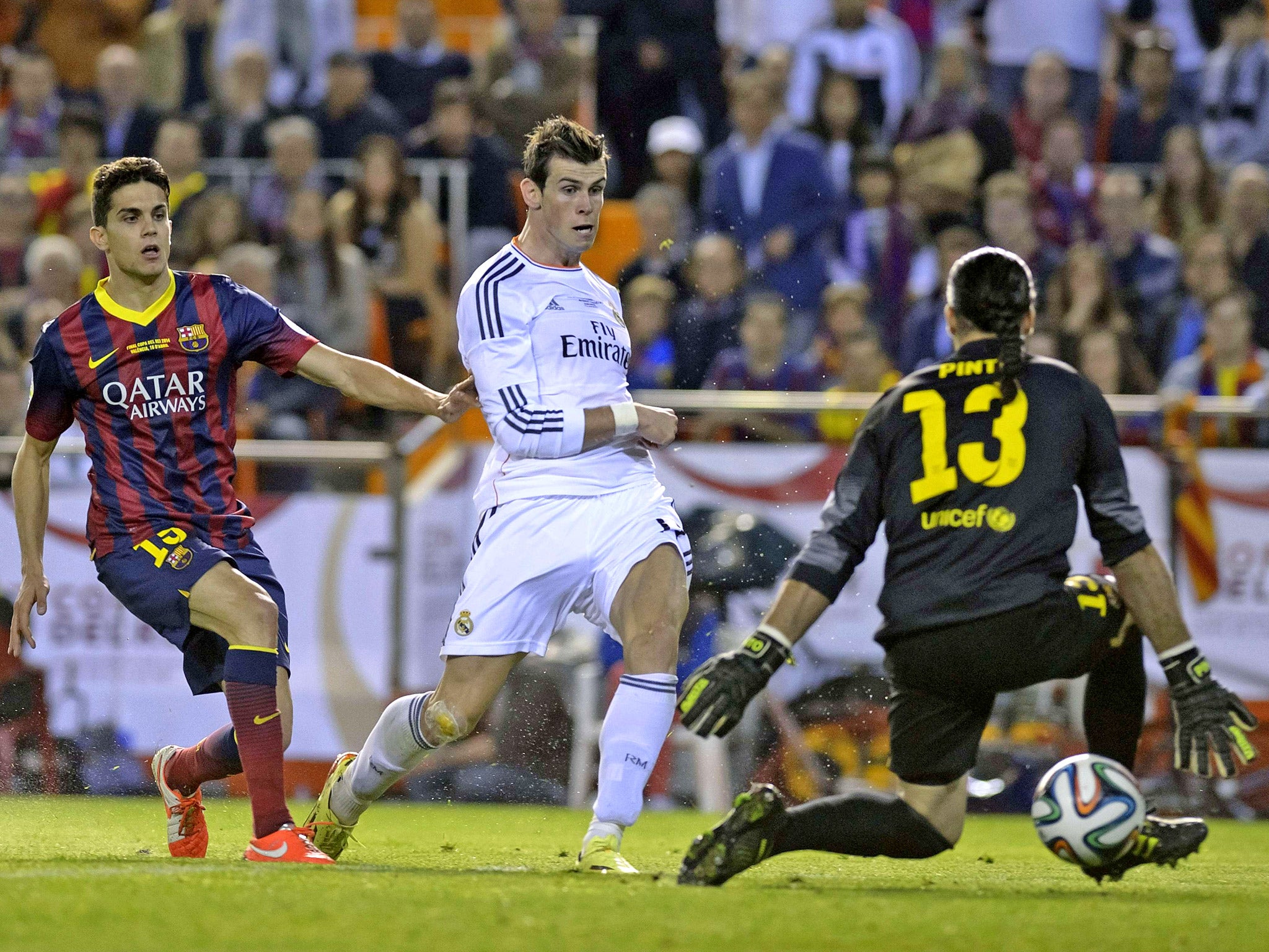 Gareth Bale dribbled from inside his own half and finished calmly late in the final to hand Real a 2-1 win at the Mestalla in Valencia