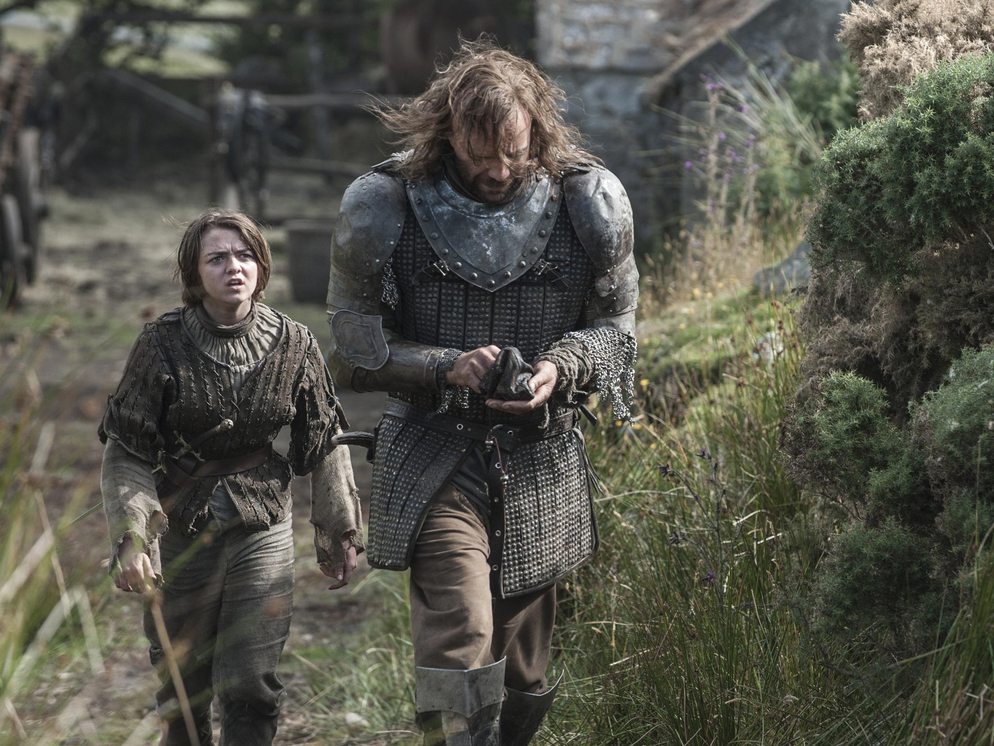 Maisie Williams as Arya and Rory McCann as The Hound