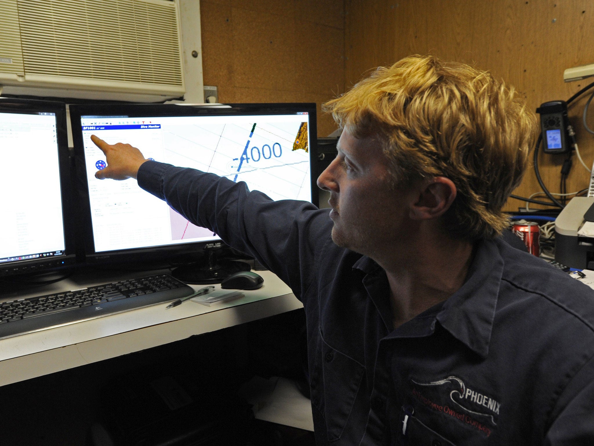 Craig Turner from Phoenix International monitoring the Artemis' depth and speed as the Autonomous Underwater Vehicle scans the ocean floor for missing Malaysia Airlines flight MH 370 in the southern Indian Ocean