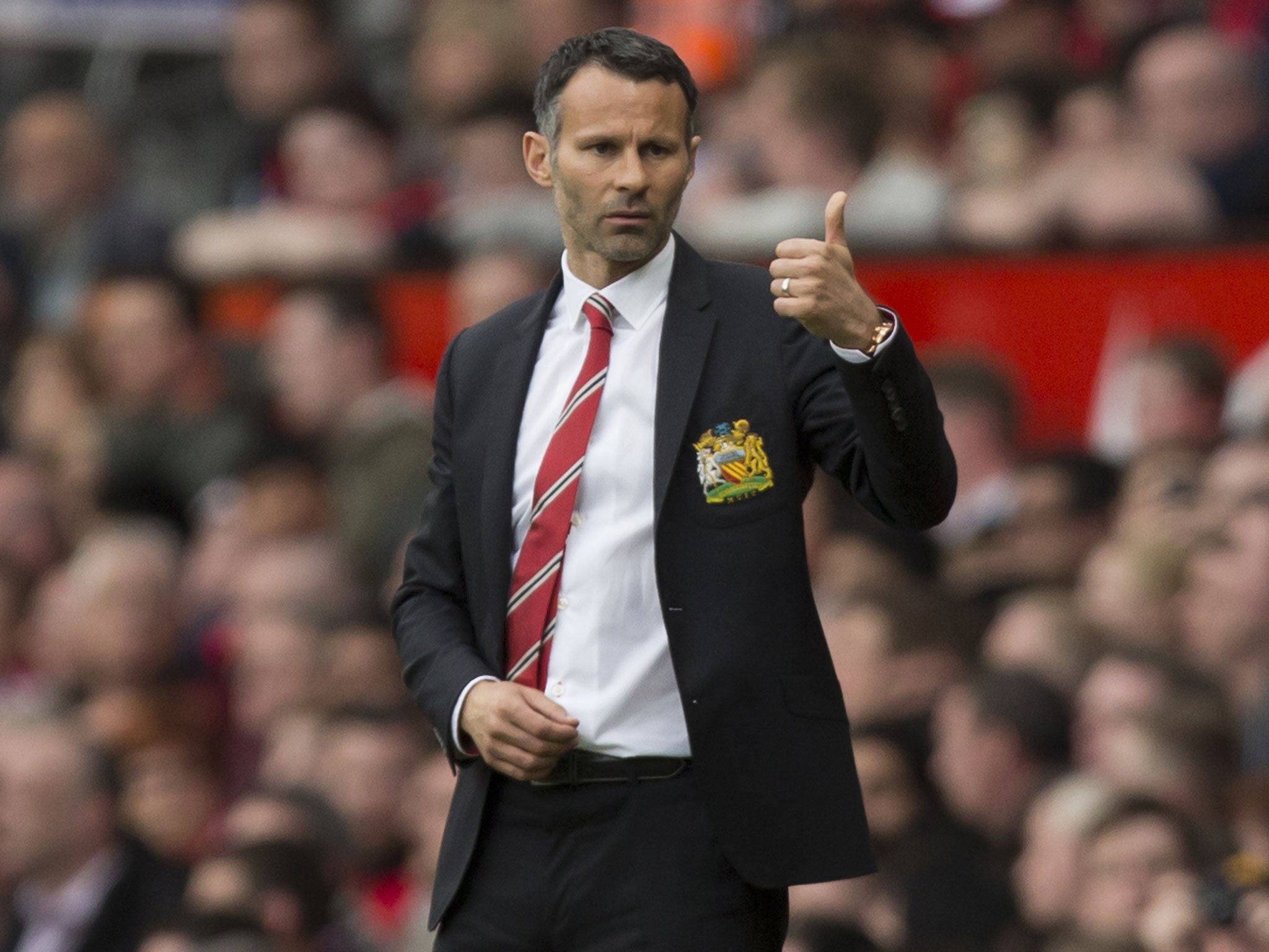 United are considering Louis van Gaal, Carlo Ancelotti and Diego Simeone, but want to keep Ryan Giggs, pictured at the club in some role