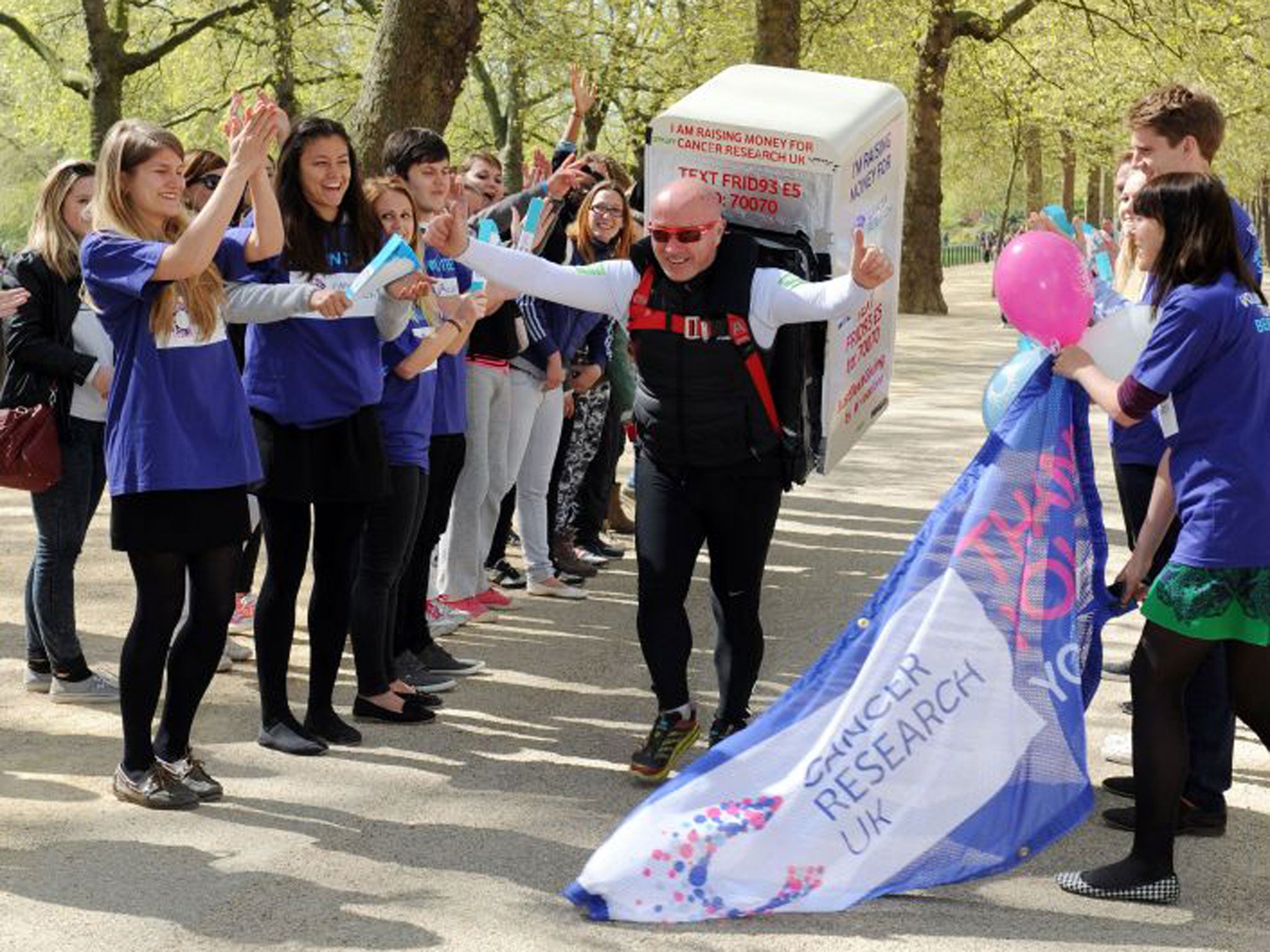 Charity runner Tony Phoenix-Morrison at the London Marathon this year. Cancer Research UK aims to boost its annual £350m spending on cures by 50 per cent over the next five to 10 years