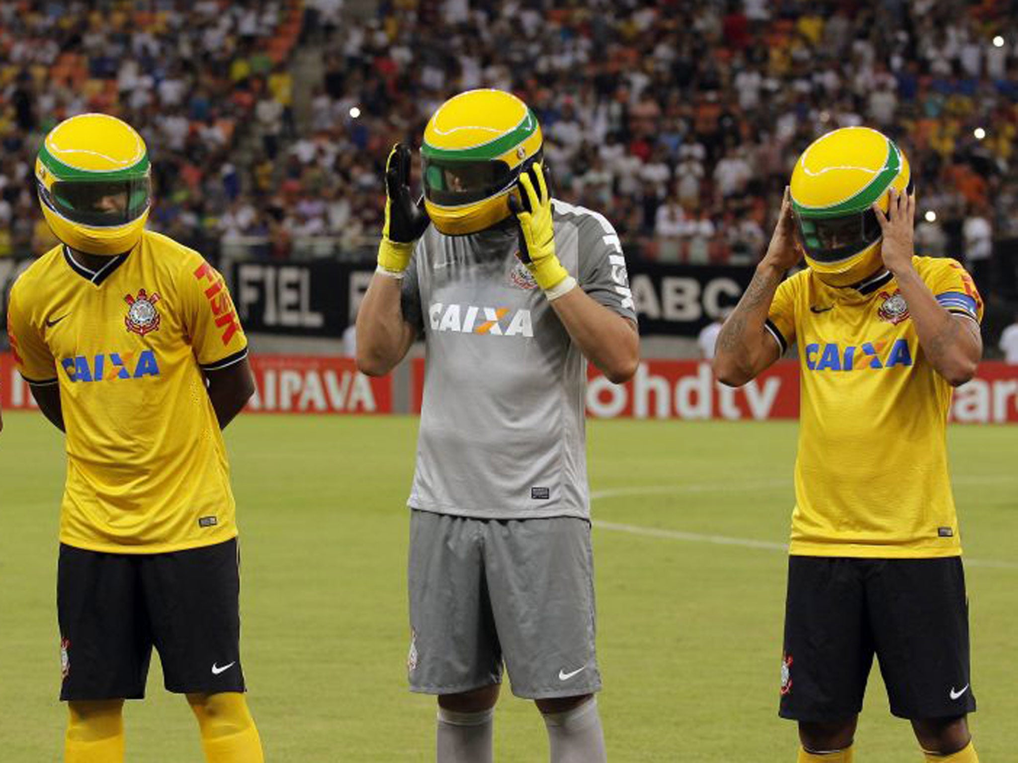 Corinthians players pay tribute to Ayrton Senna by donning replica helmets