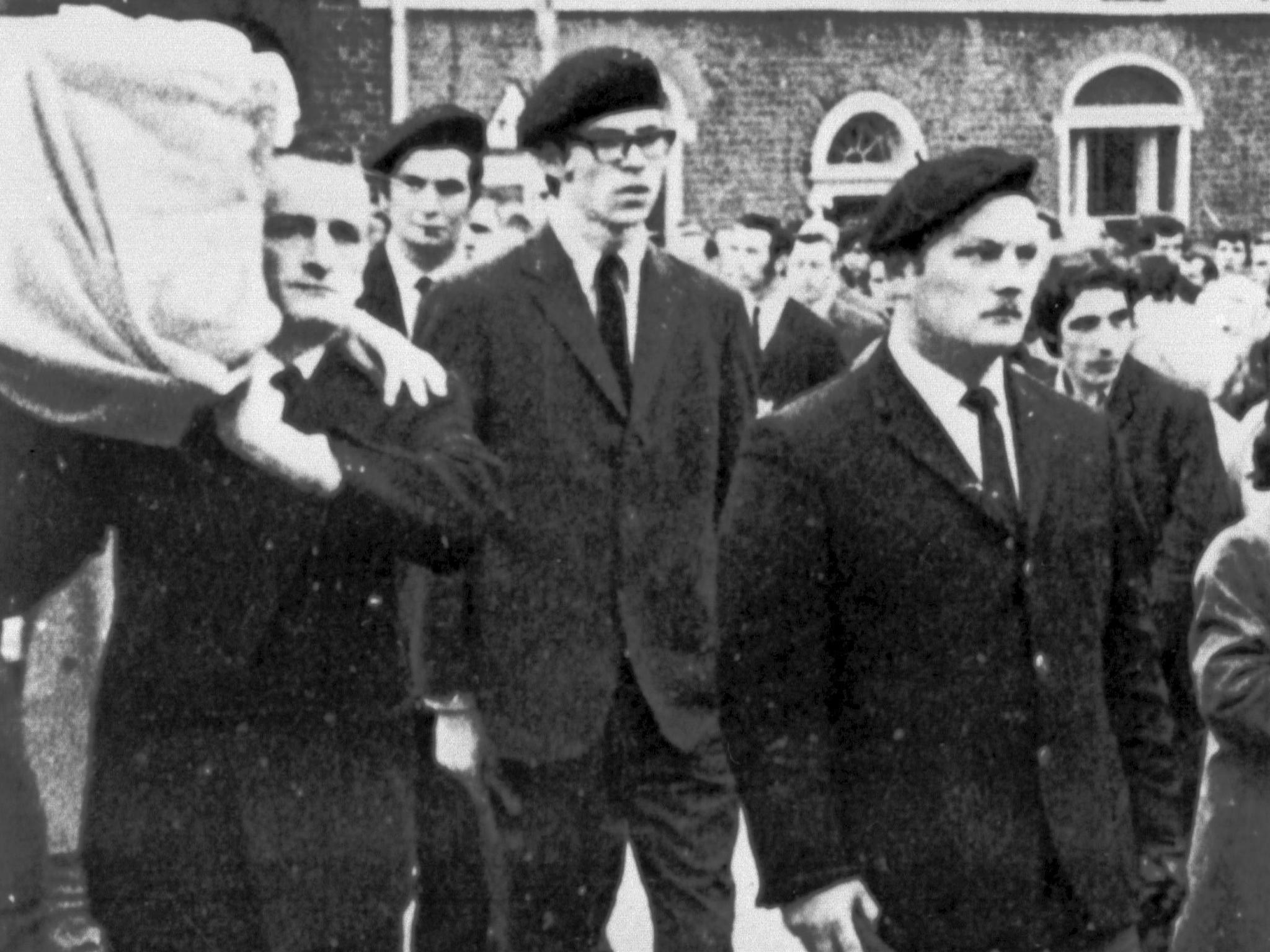 Gerry Adams (right) in the guard of honour at the funeral of an IRA member in 1973