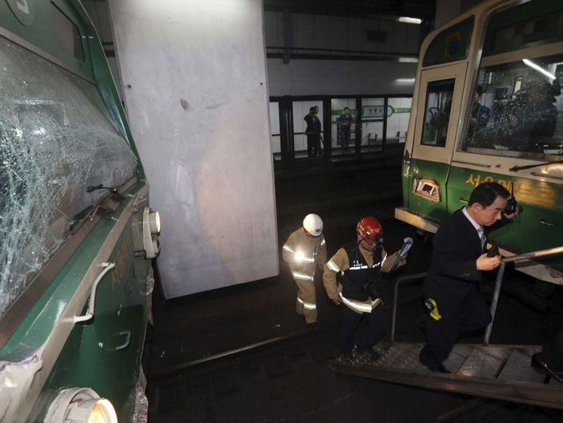 Damaged subway trains are seen at a station in Seoul on 2 May 2014.