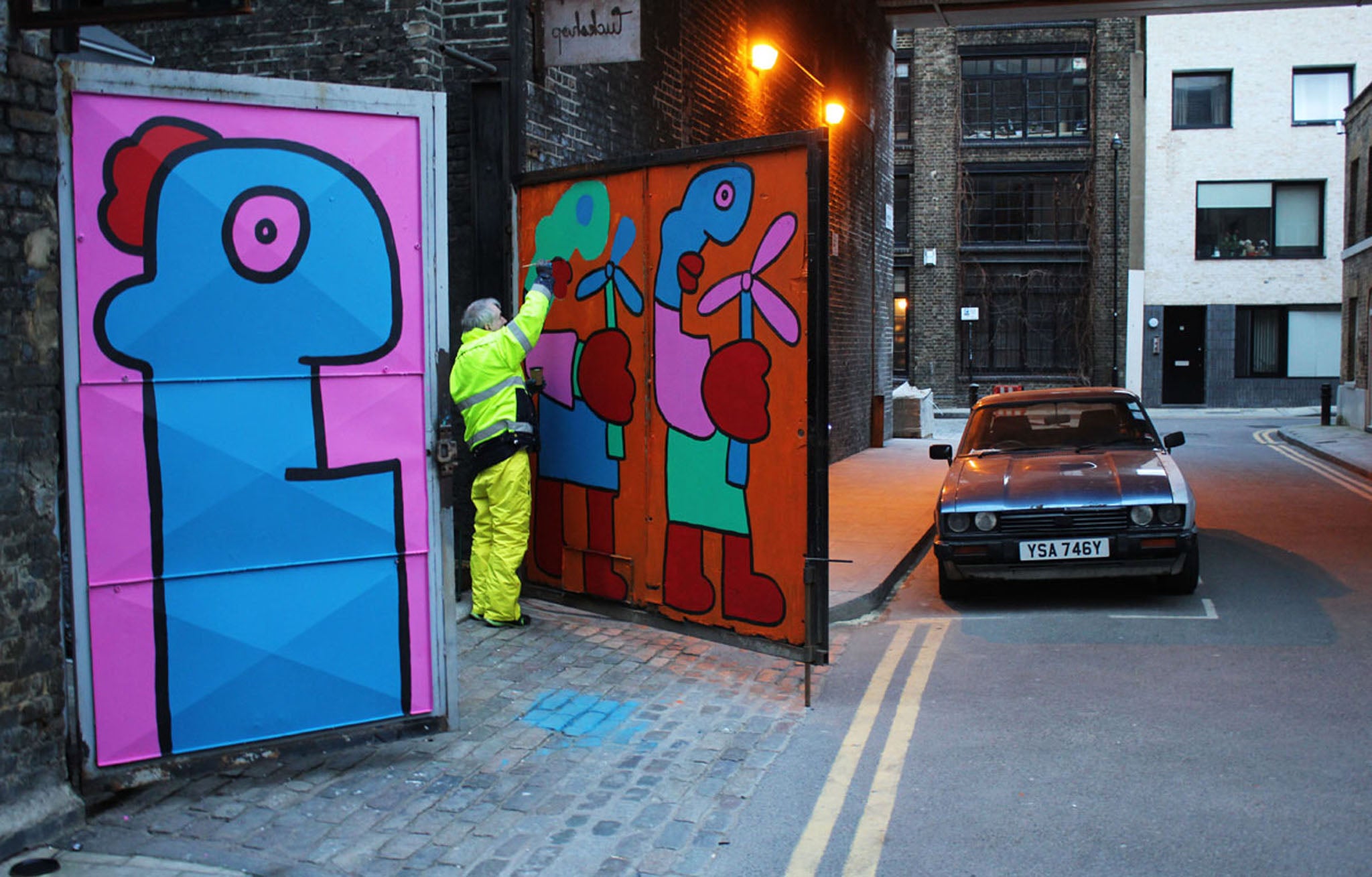 Thierry Noir paints a door in Shoreditch, East London