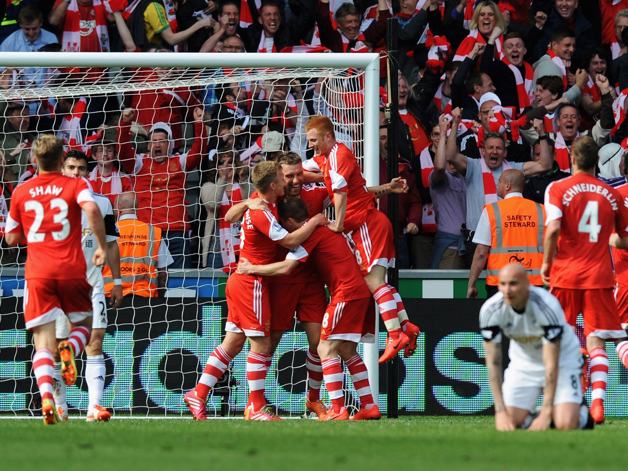 Rickie Lambert celebrates with his teammates after scoring the winning goal