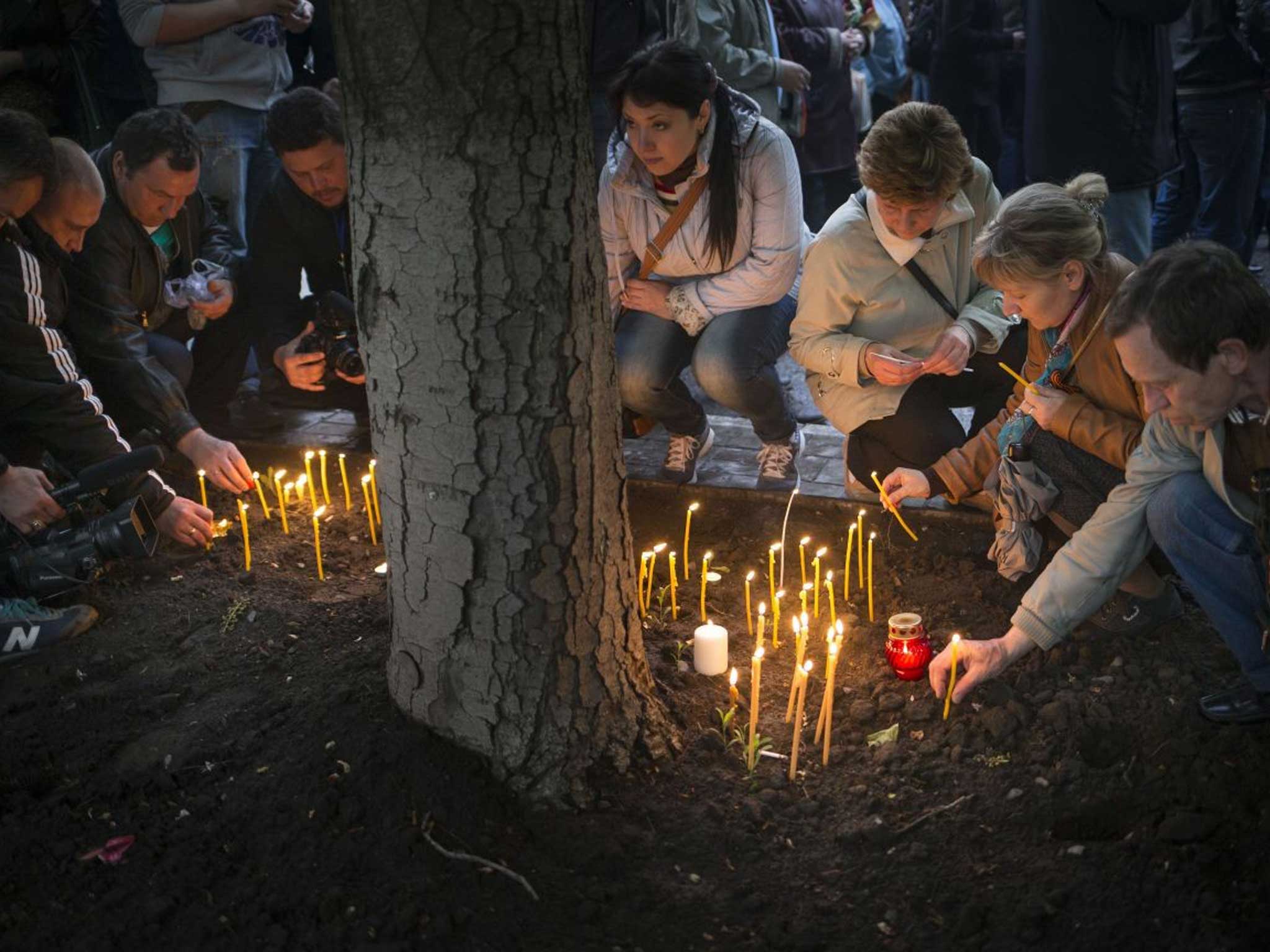 Pro-Russian protesters hold a vigil for dead comrades in Donetsk