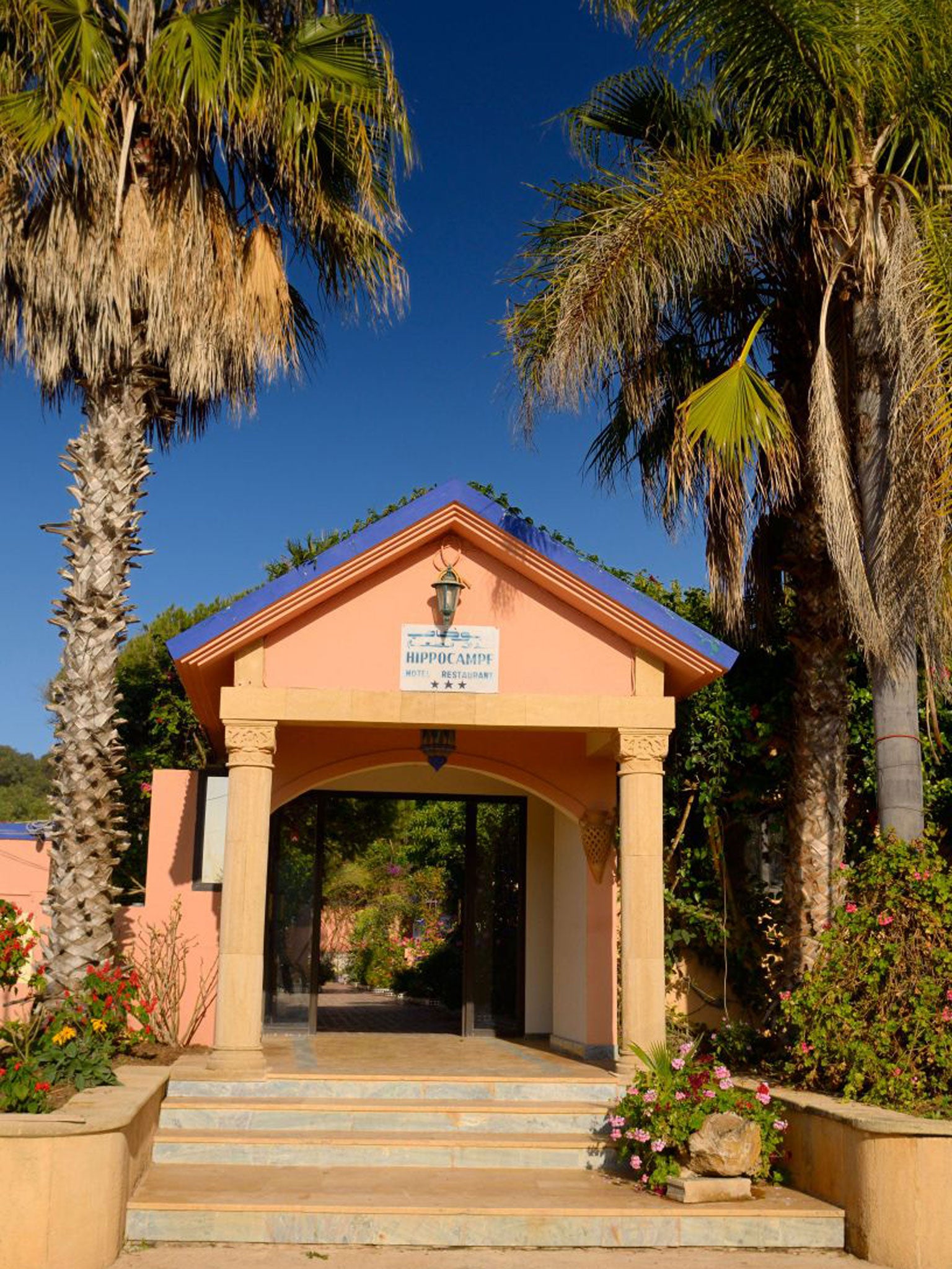 The entrance to L'Hippocampe which is 'family-run, and perfumed by flowers and sea air'